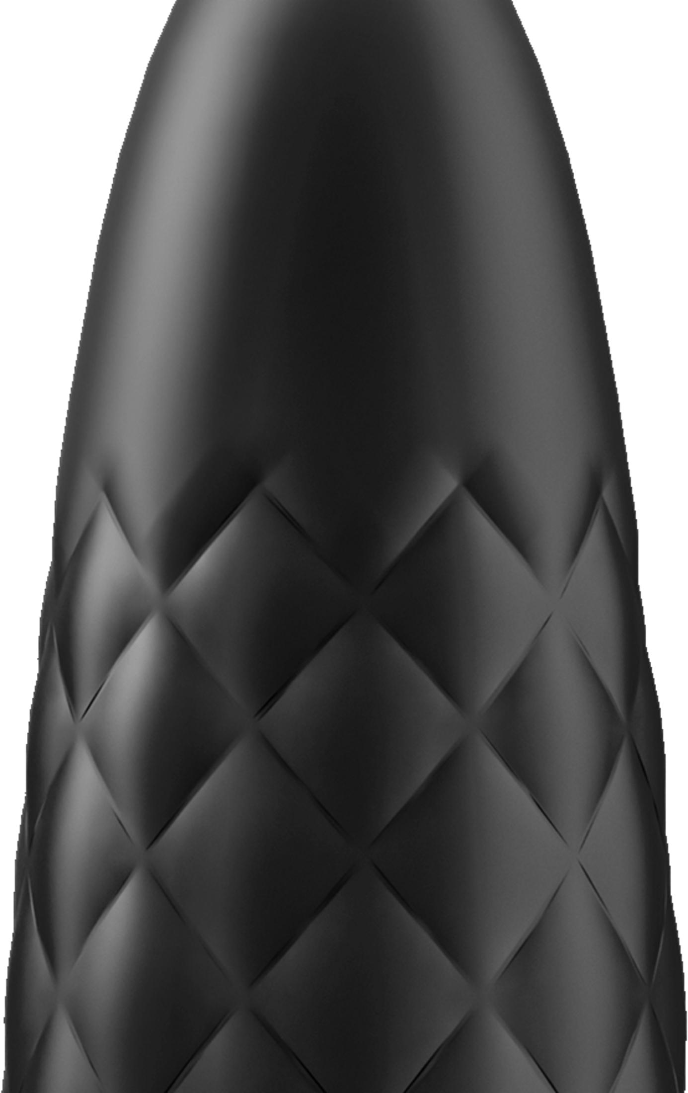 Czarny przedmiot z romboidalnym wzorem i gładką górą.