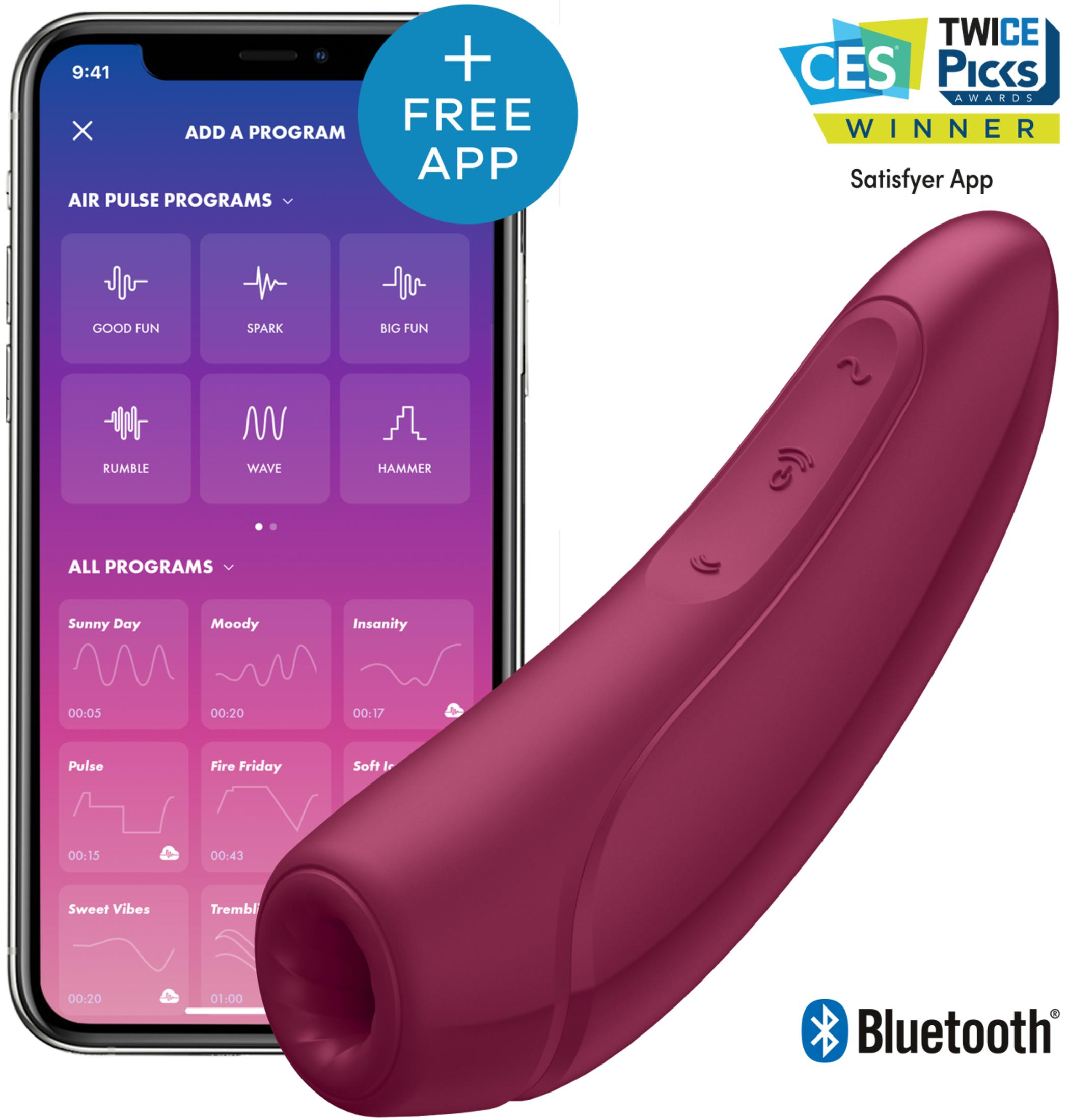 Smartfon pokazuje aplikację Satisfyer z programami. Obok leży fioletowy wibrator. Zdobywca nagrody CES.