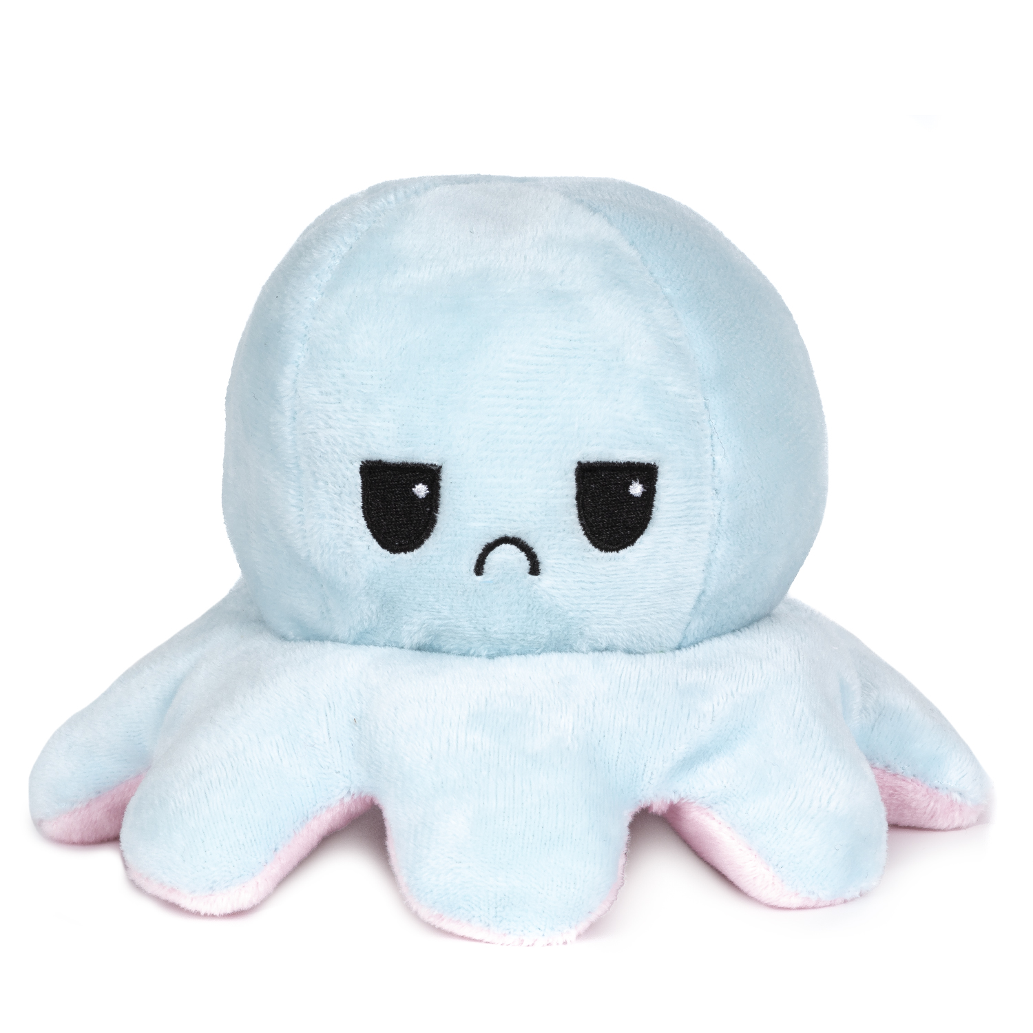 Un peluche polpo azzurro con punte di tentacoli rosa e una faccia triste.