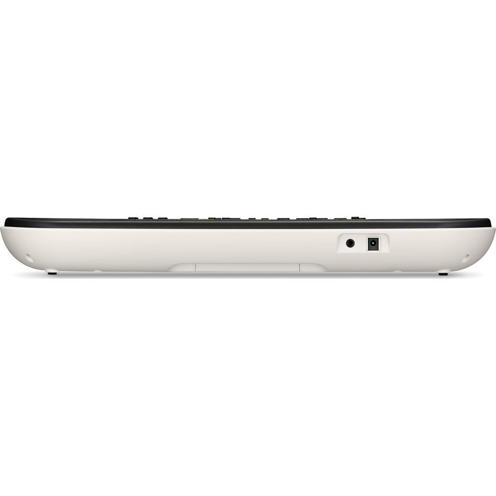 Side view of a white keyboard with black keys and a round connector port.