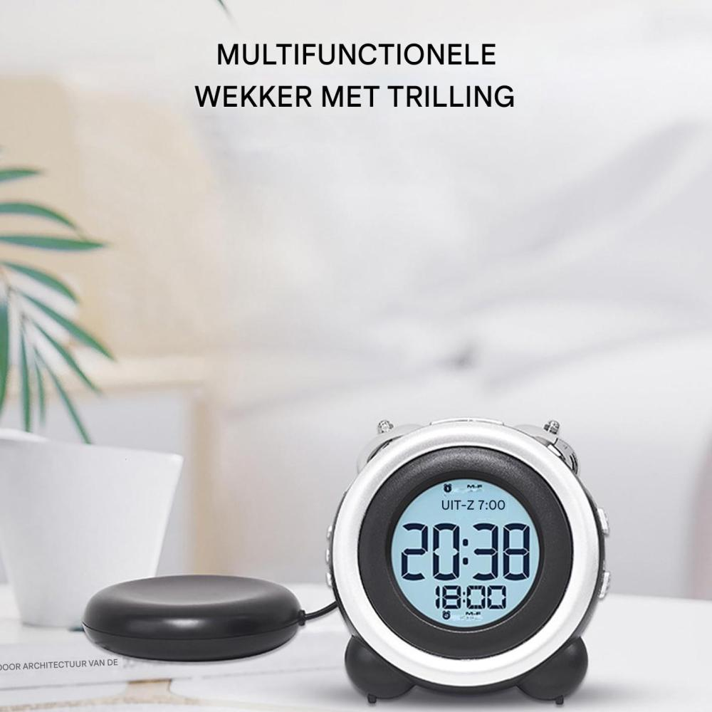 Ein multifunktionaler Wecker mit Vibrationsfunktion und einer schwarzen Vibrationsbasis.