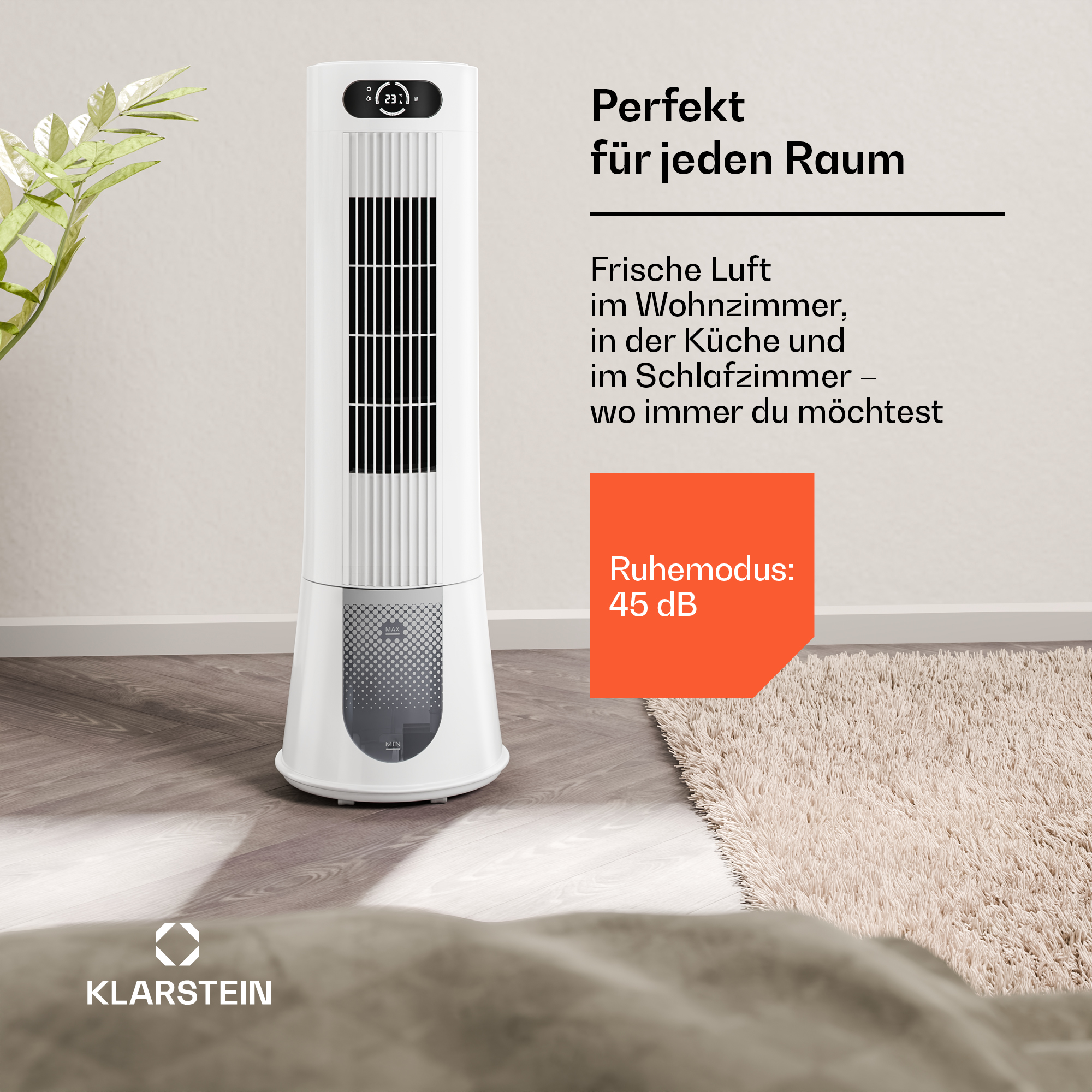 Ein weißer Turmventilator steht auf einem Holzboden neben einem Teppich.