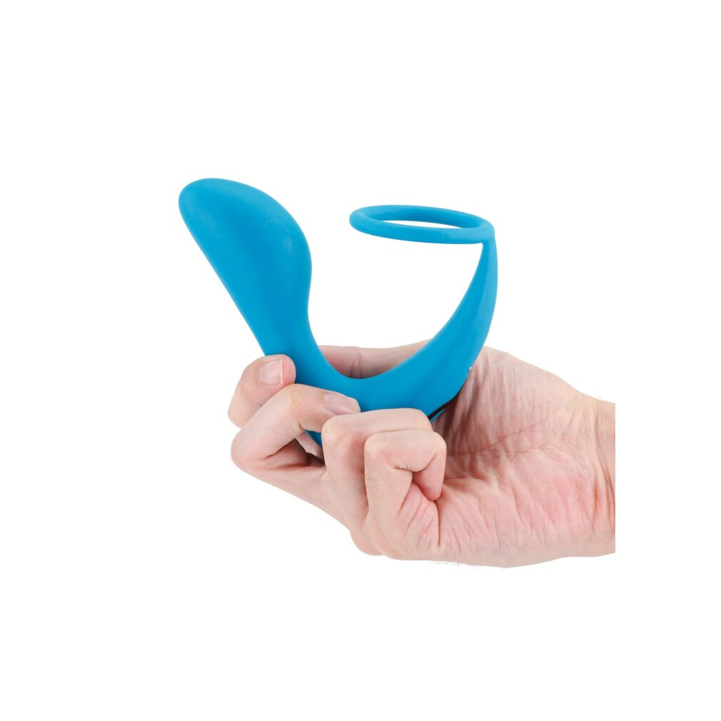 Eine Hand hält einen blauen Gegenstand mit einem Ring in der Mitte.