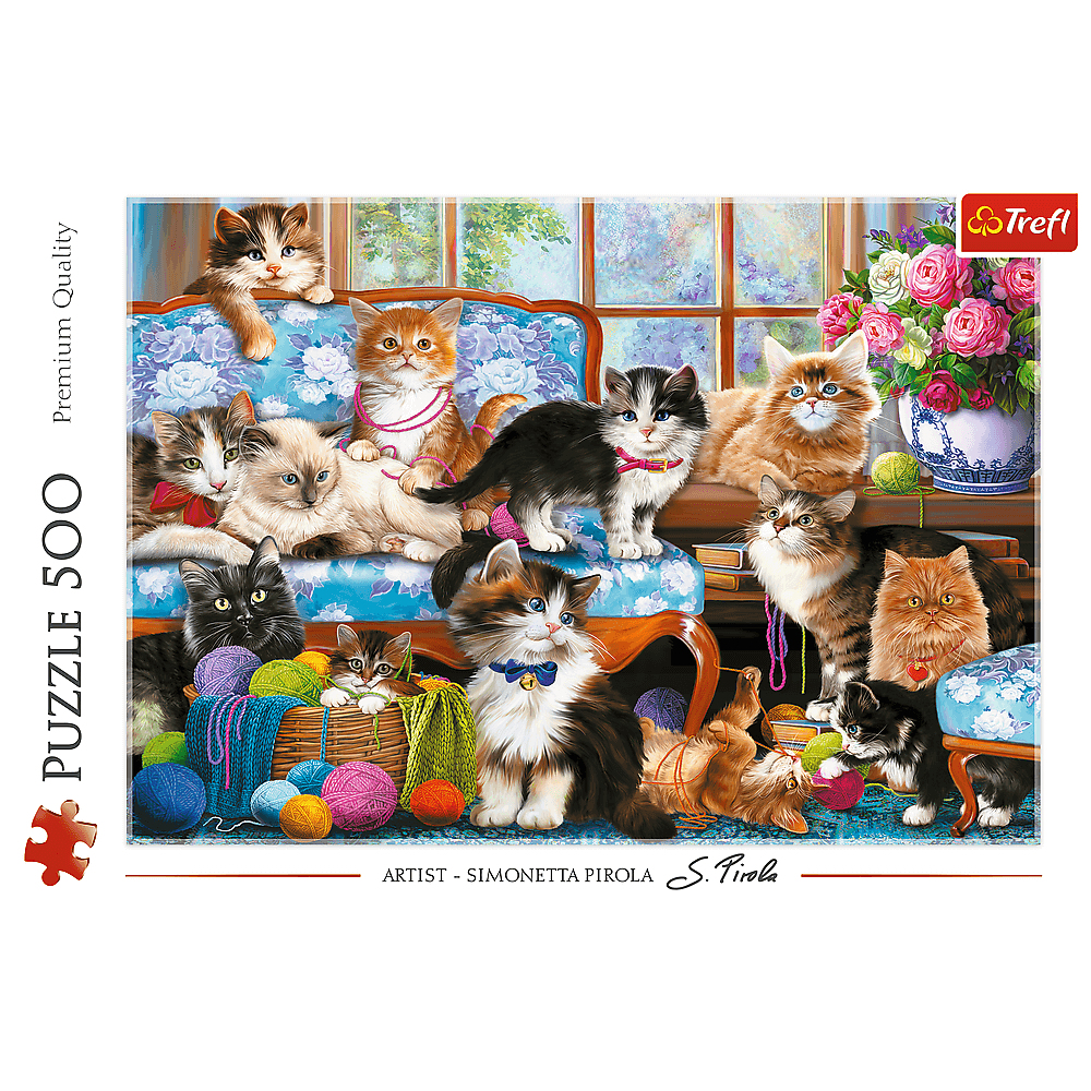 Eine Gruppe von Katzen sitzt auf einem blauen Sofa mit Blumenmuster und spielt mit Garn.