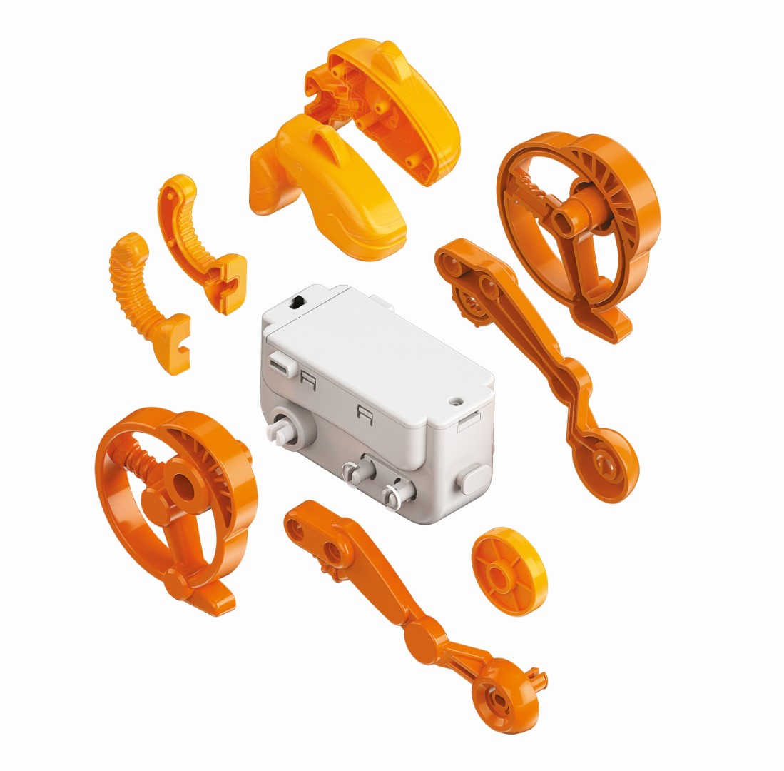 Ein weißer Motorblock mit orangefarbenen Bauteilen wie Zahnrädern und Gelenkarmen.