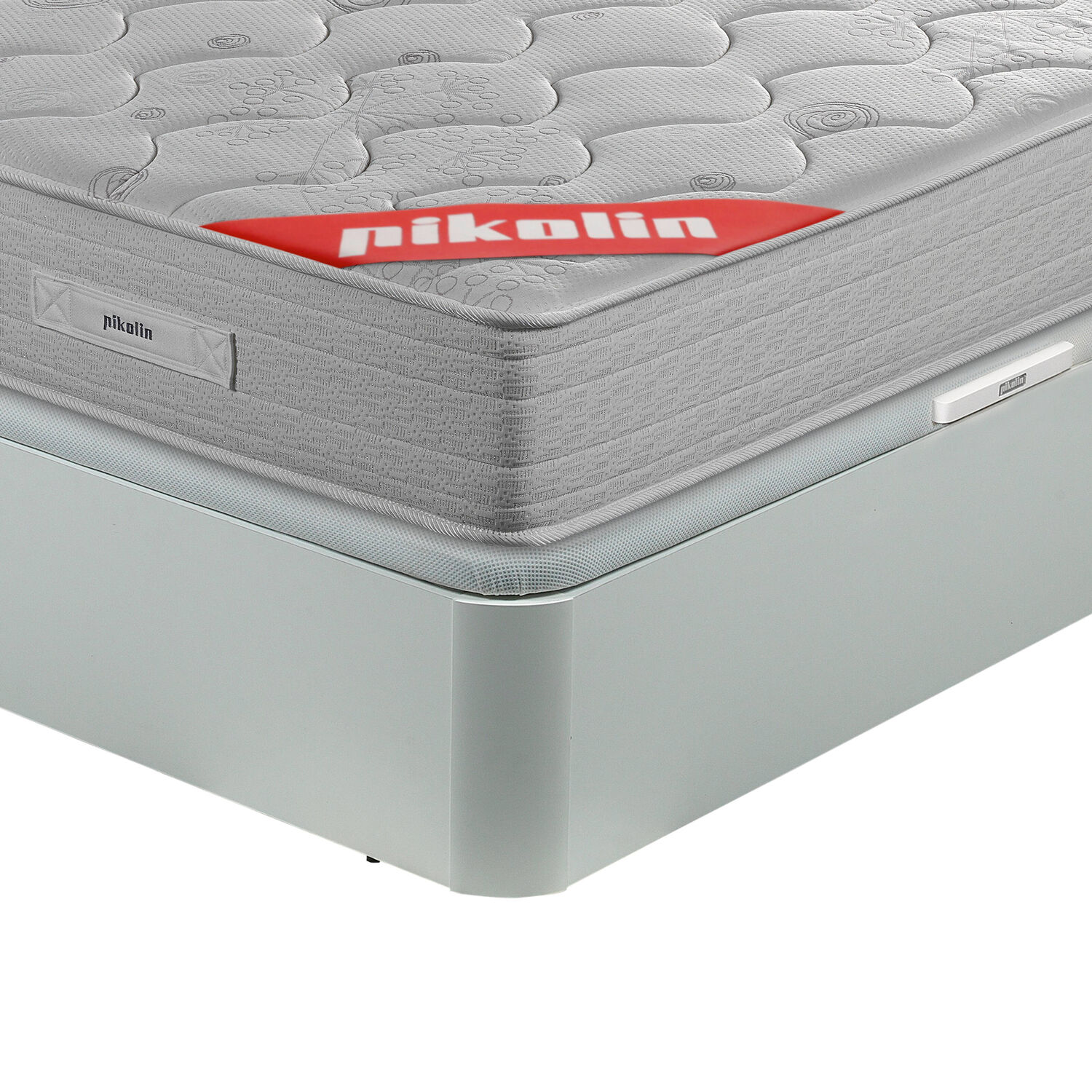 Colchón gris con logo rojo "pikolin" sobre un somier gris claro.