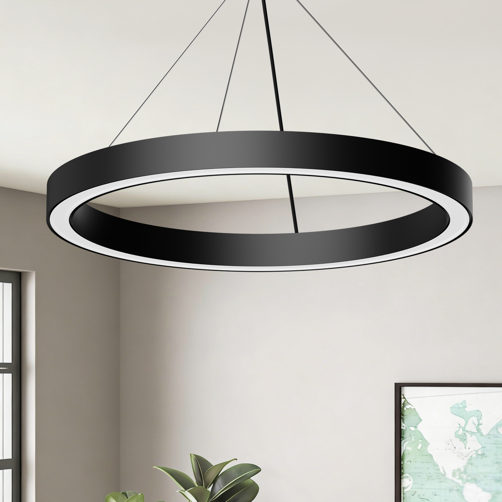 Un moderno candelabro de anillo negro con iluminación LED blanca, suspendido del techo.