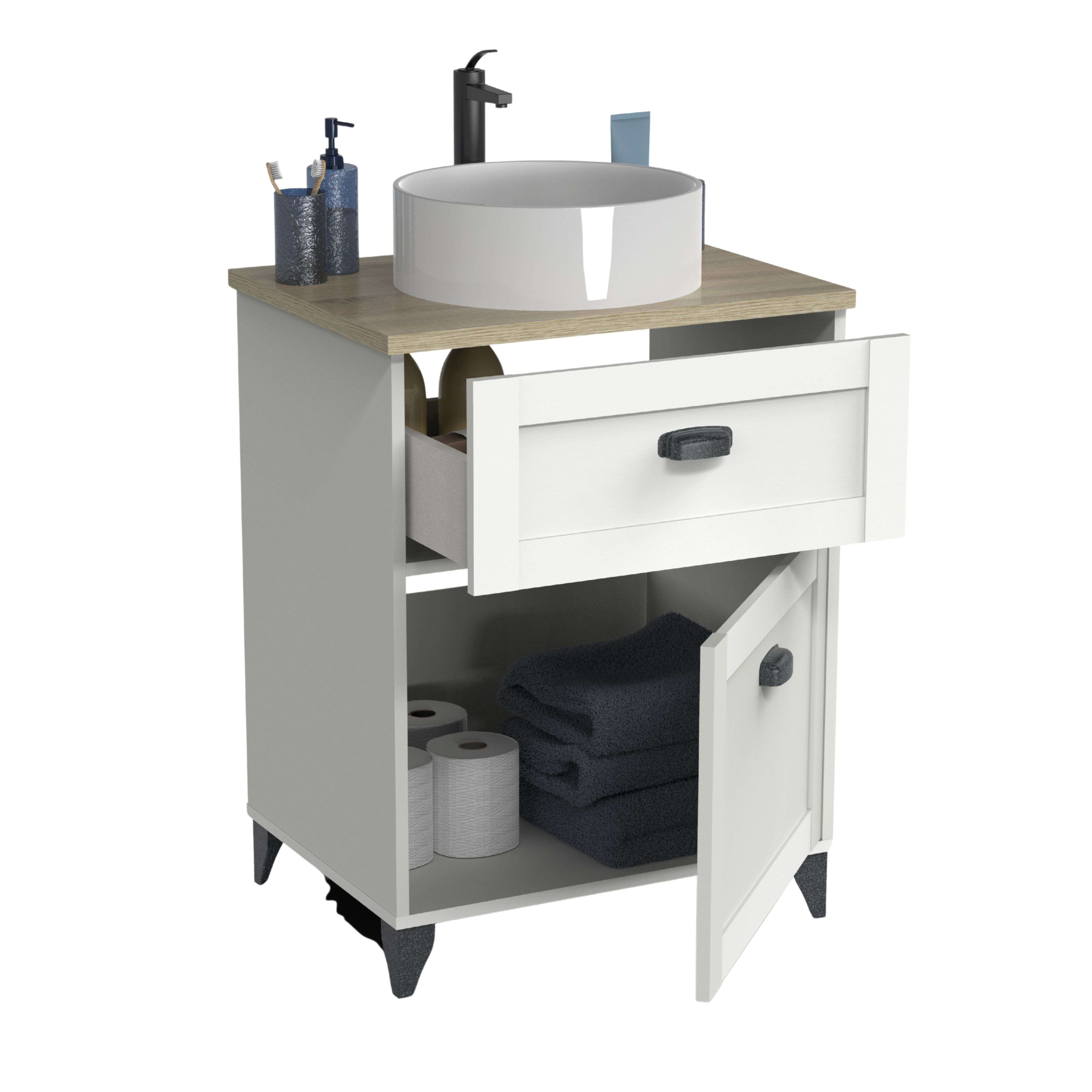 Un mueble de baño blanco con puerta y cajón abiertos, con toallas y papel higiénico.
