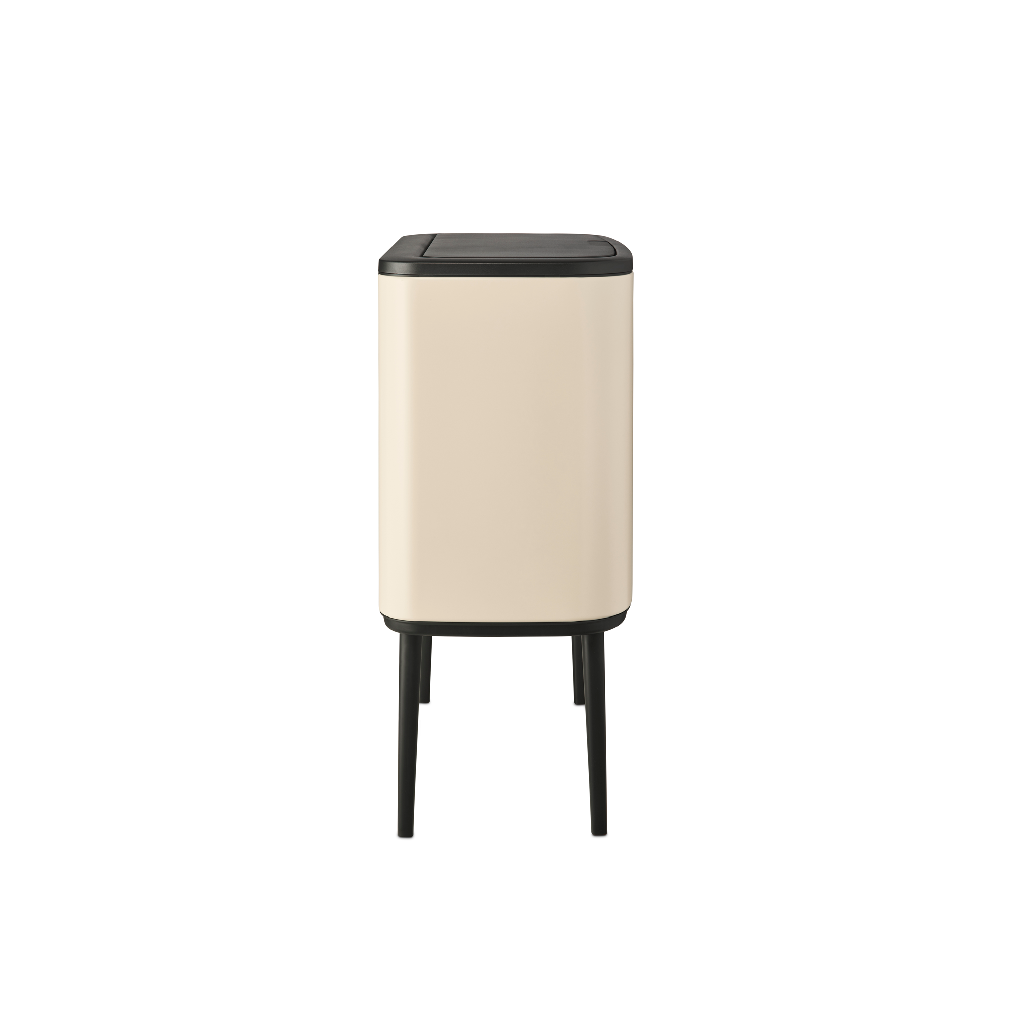 A cream-colored trash can with a black lid and four legs.
