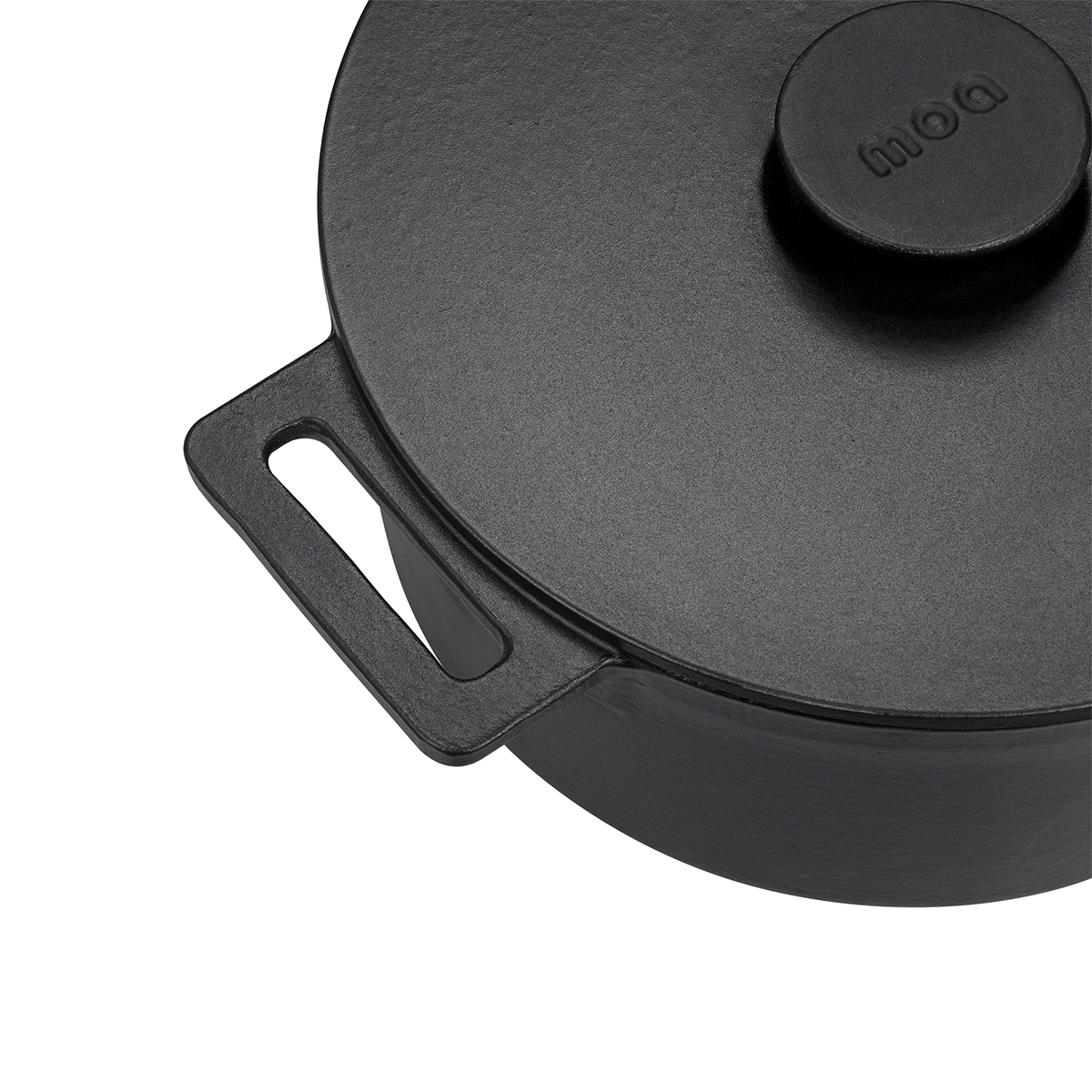 Black cast iron pot with handle and Moa logo on the lid.