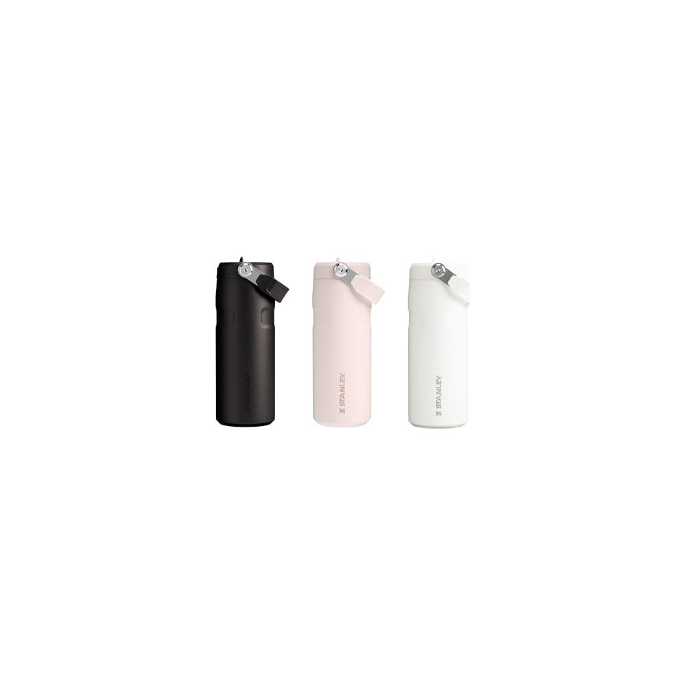 Tres botellas Stanley en negro, rosa y blanco, cada una con asa.