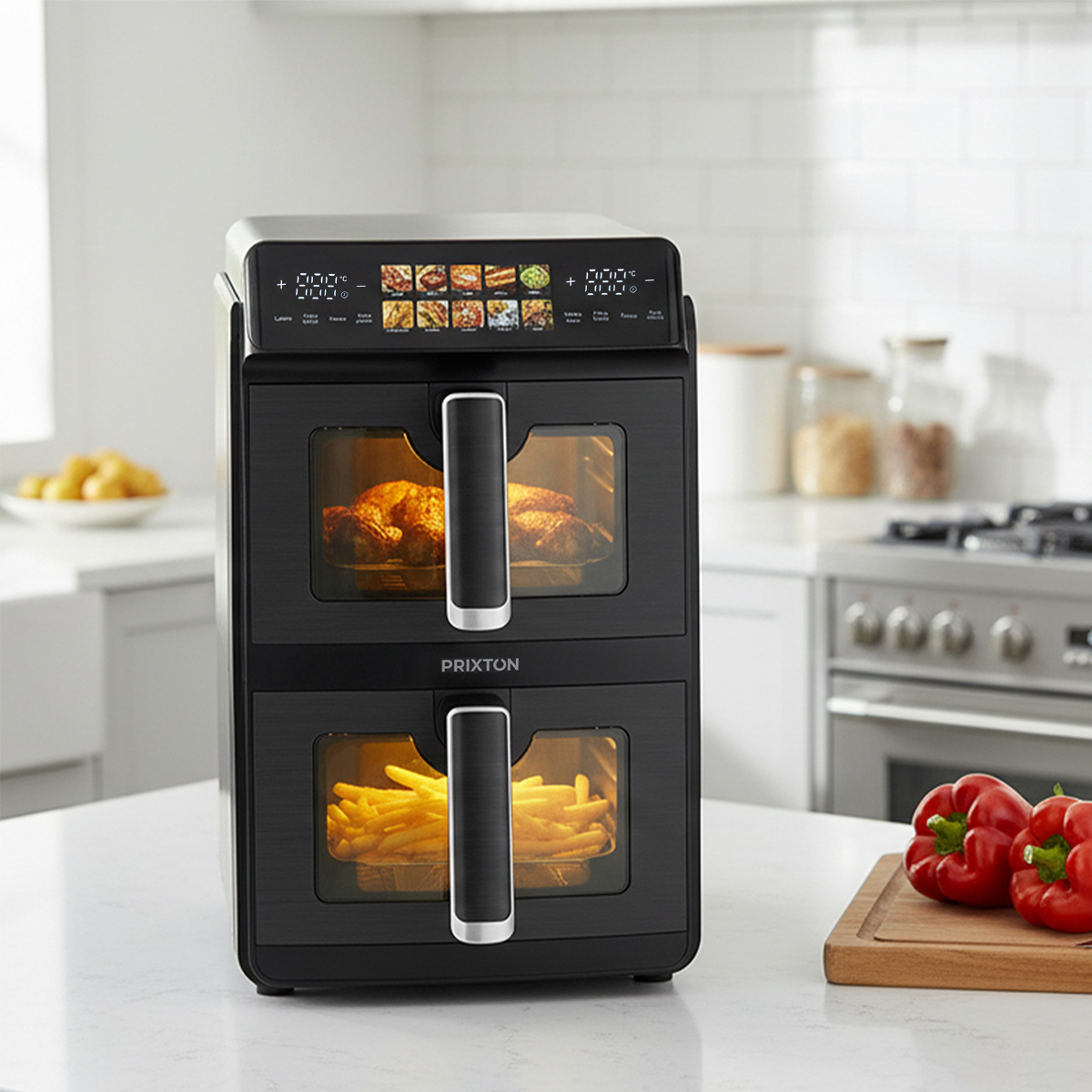 A black double air fryer with chicken on top and fries on the bottom.