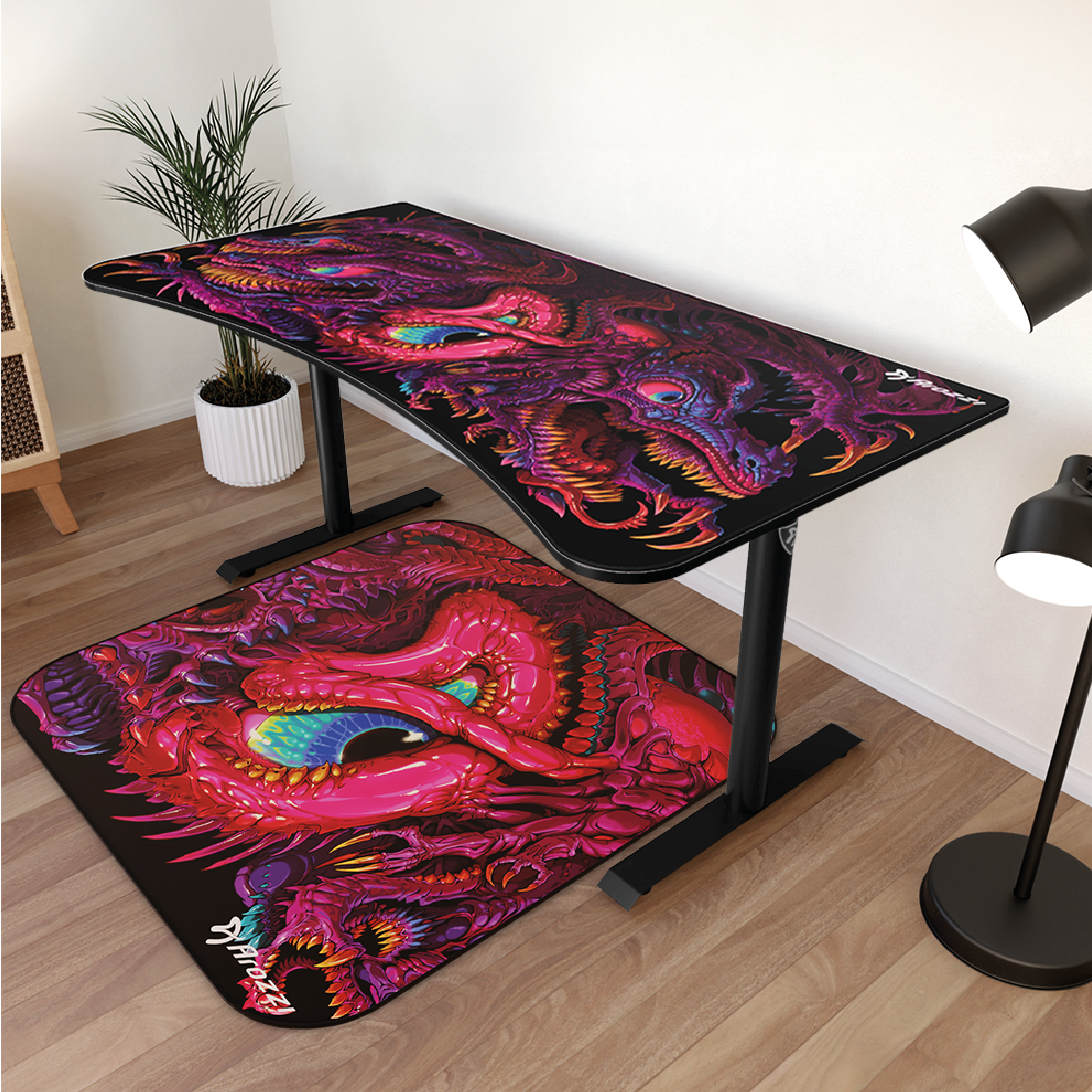 Een bureau met een muismat met drakenmotief. Het ontwerp toont een rode, ingewikkelde draak.