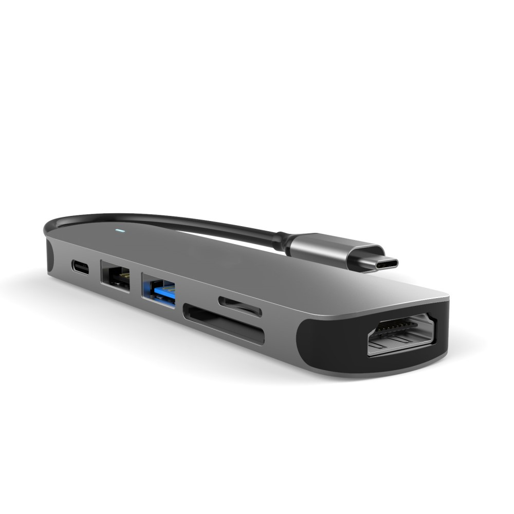 Hub USB-C grigio con HDMI, USB-A, slot per schede SD e cavo.