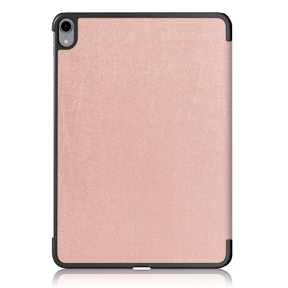 Ein roségoldenes Tablet mit Kameras auf der Rückseite, auf weißem Hintergrund.