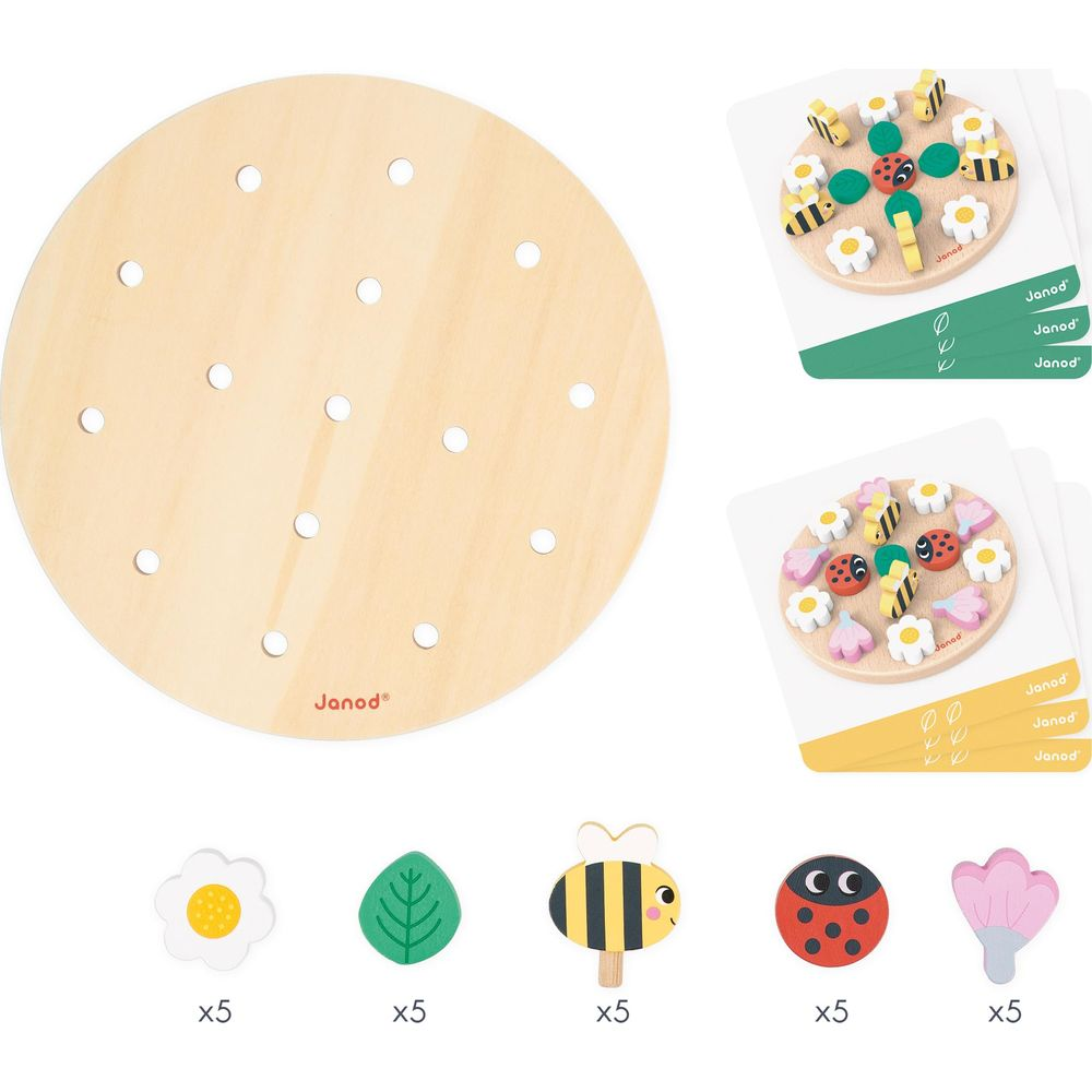 Gioco in legno con motivi di fiori, foglie, coccinelle e api su tavola rotonda.