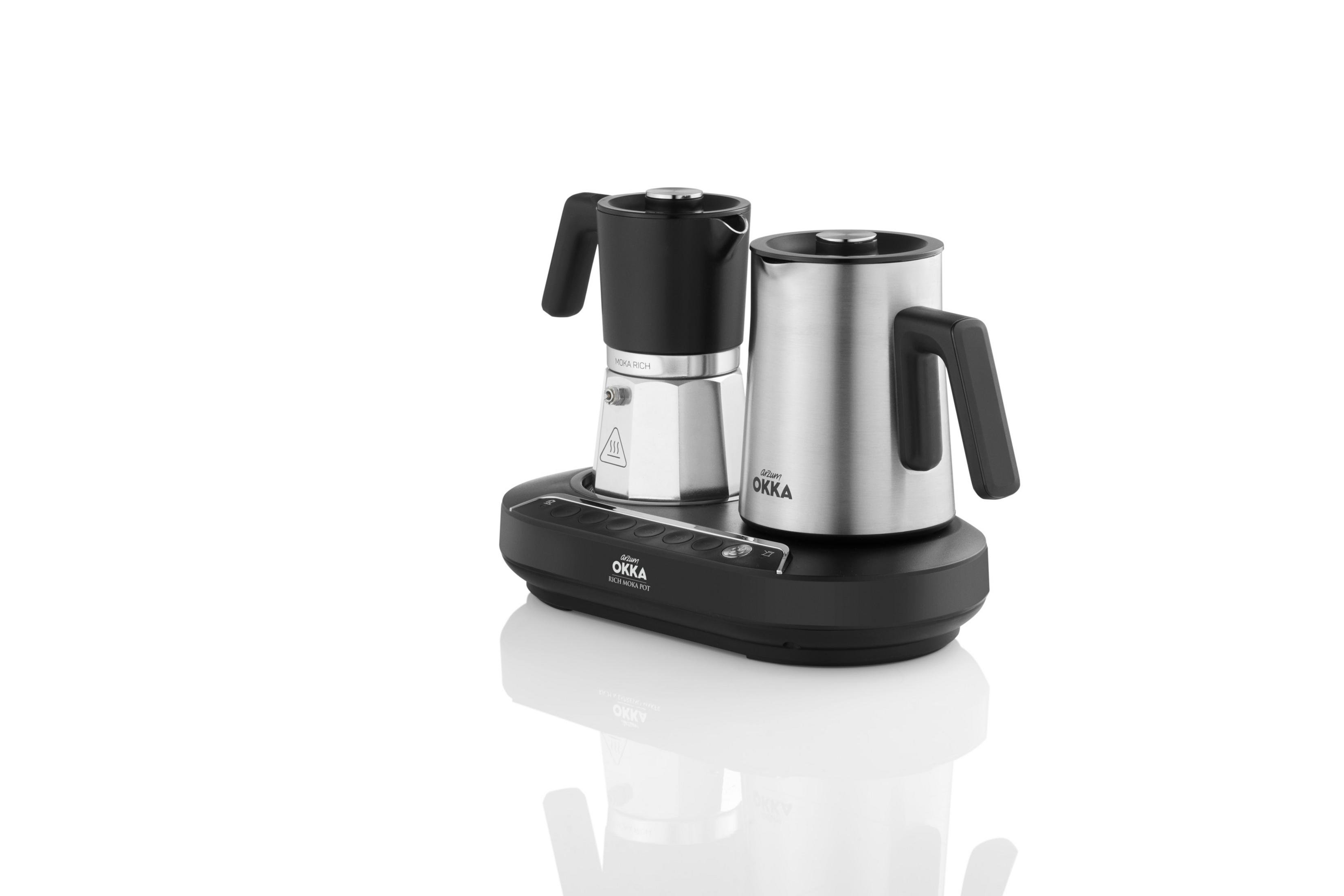 Una caffettiera argento e nera con due pentole su base nera.