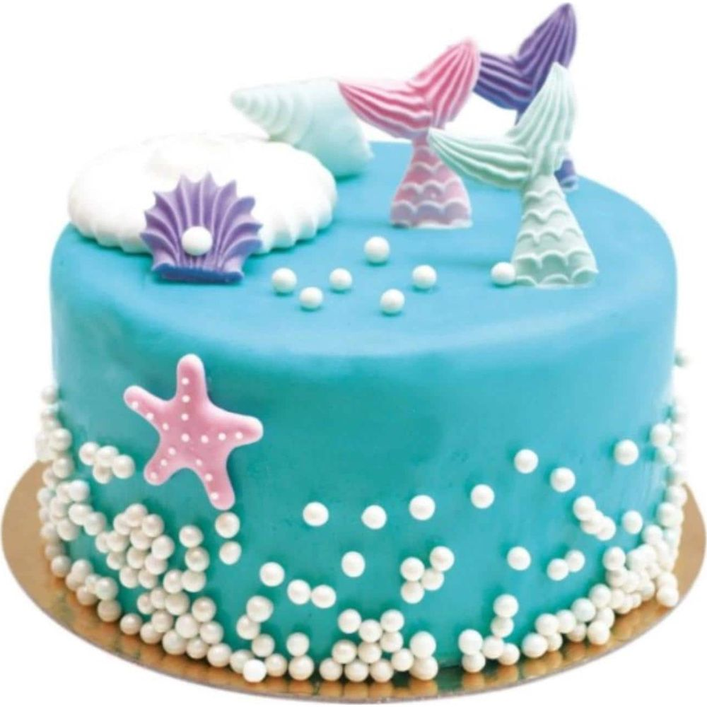 Blaue Meerjungfrauen-Torte mit Seestern, Muscheln, Perlen und Schwänzen.