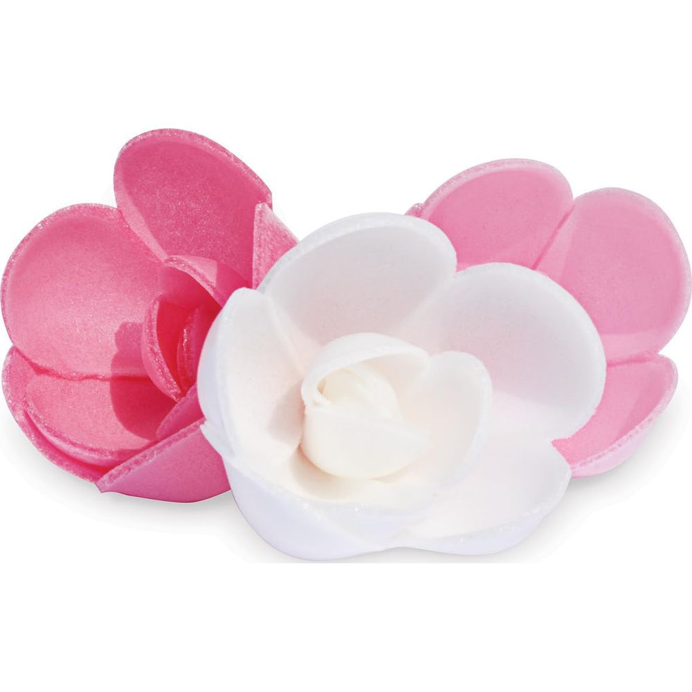 Deux fleurs artificielles, une blanche et une rose, placées côte à côte.