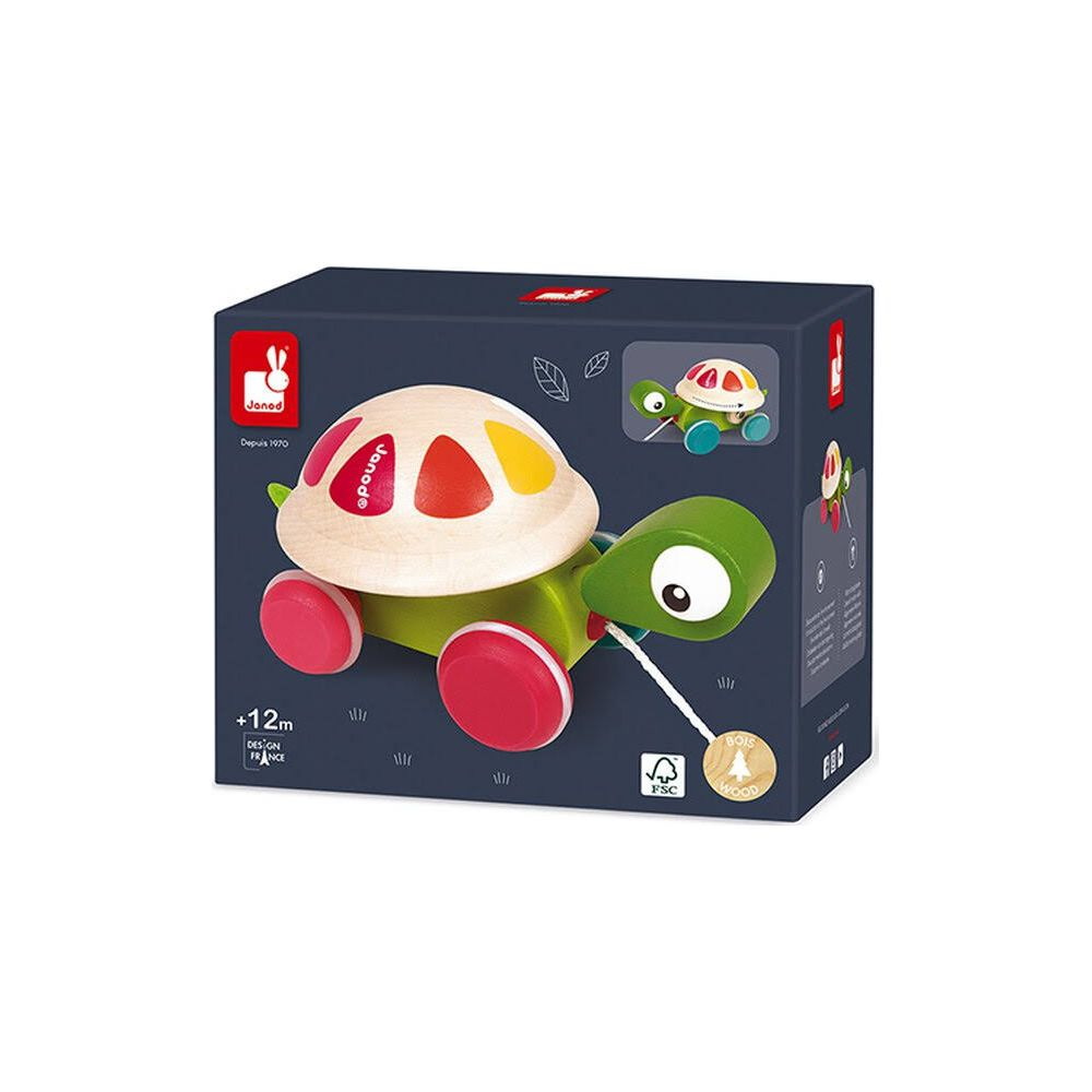 Gioco tartaruga in legno Janod su scatola blu scuro. Ha ruote rosse e un guscio colorato.