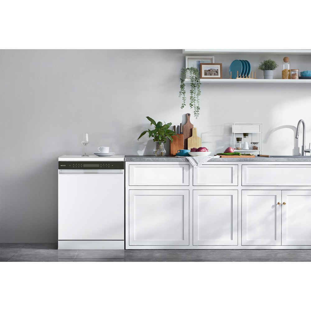 Modern white kitchen with built-in dishwasher, countertop, and cabinets.