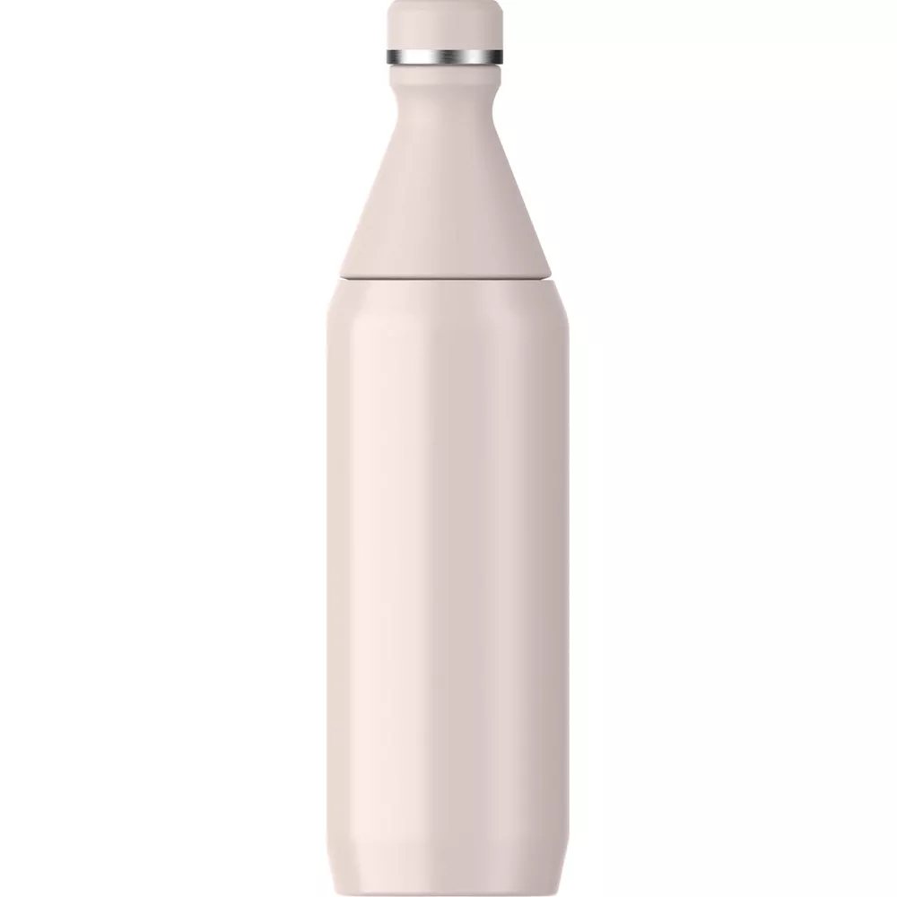 Una botella de color crema claro con tapa plateada y cuello estrecho.