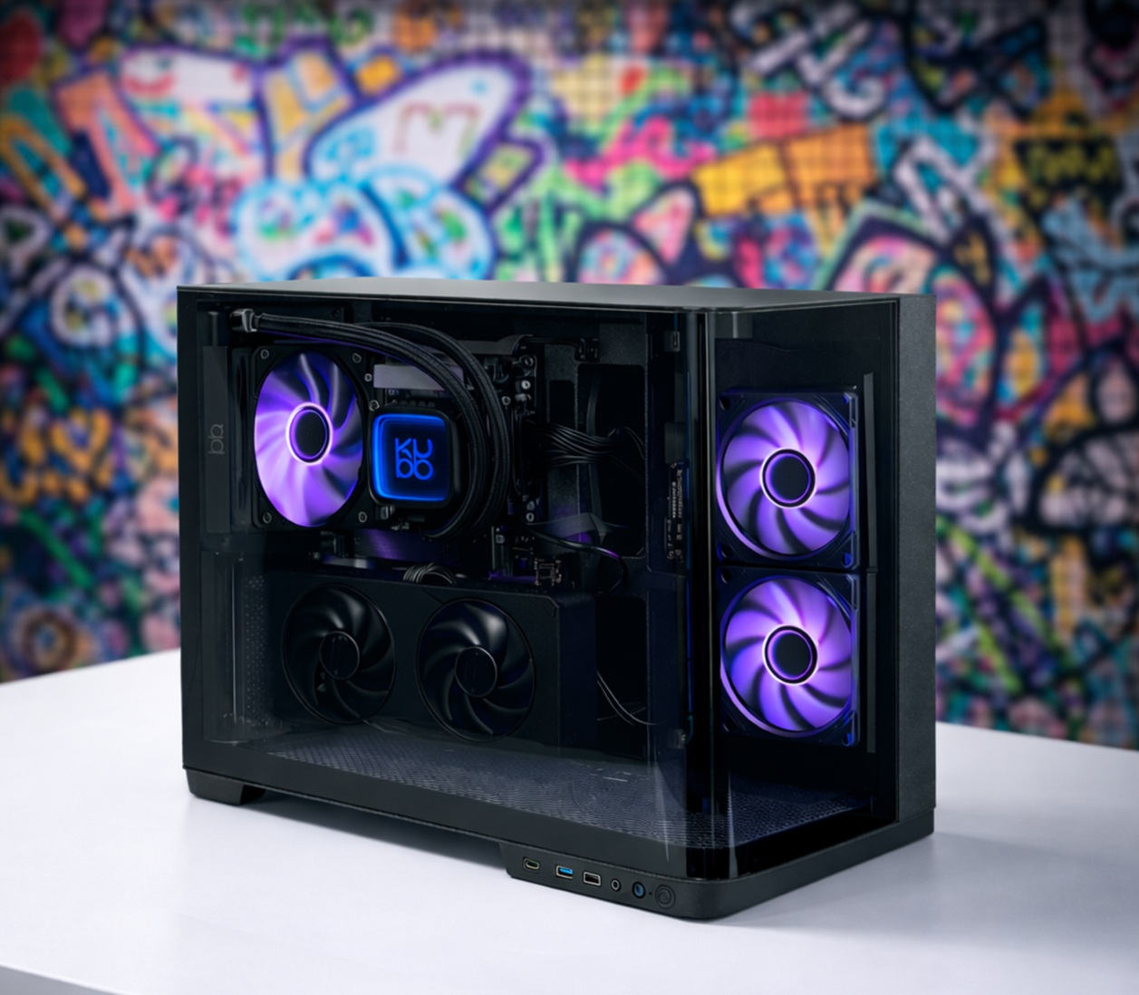 Czarna obudowa PC z fioletowymi wentylatorami i graffiti w tle.