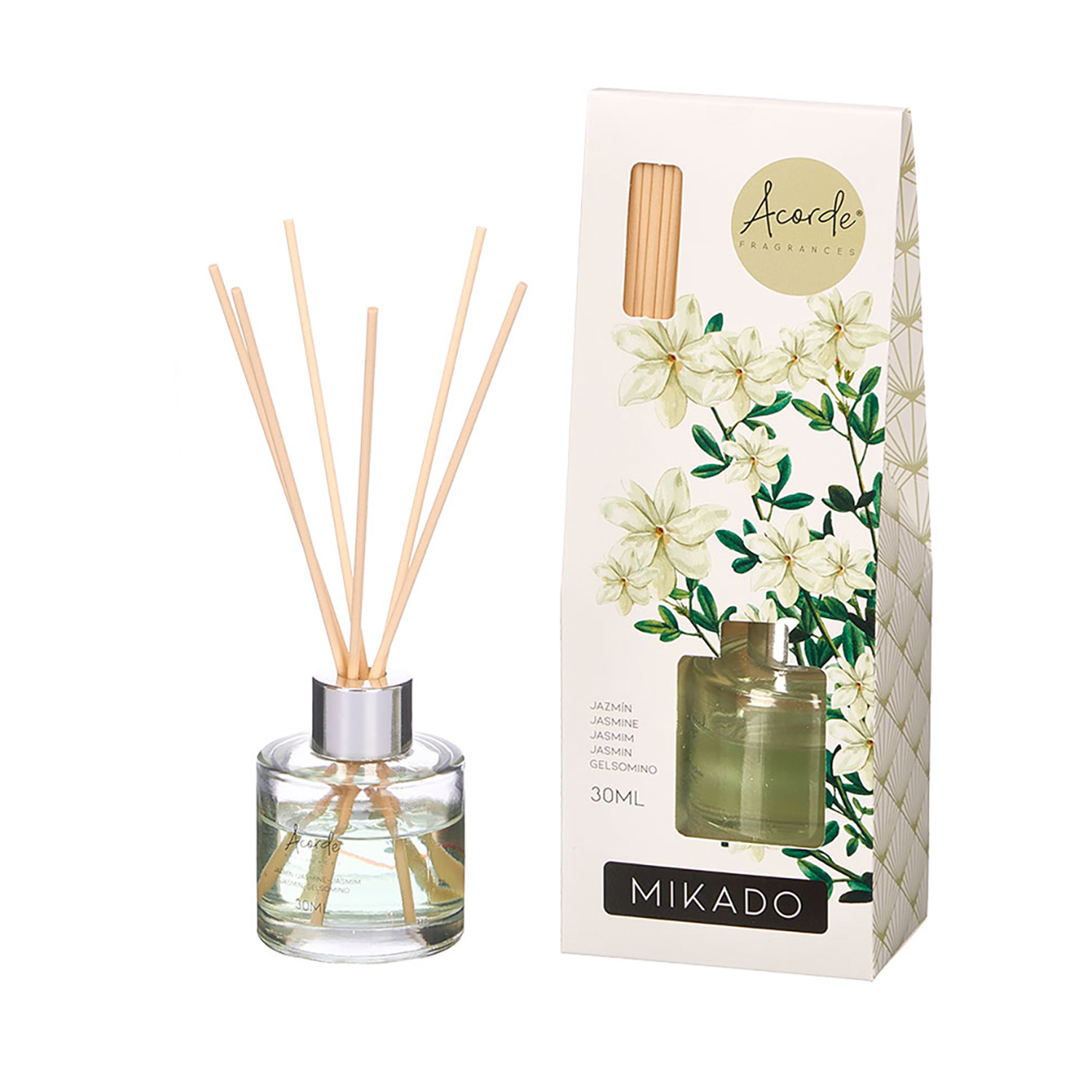 Una botella difusora de vidrio transparente con varillas y una caja con flores de jazmín.