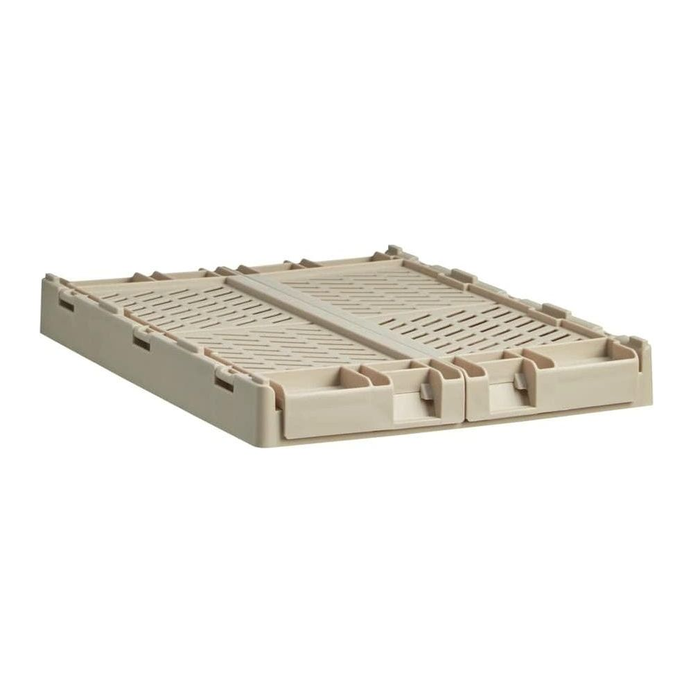 Eine beige faltbare Kiste mit Lüftungsschlitzen und Griffen.