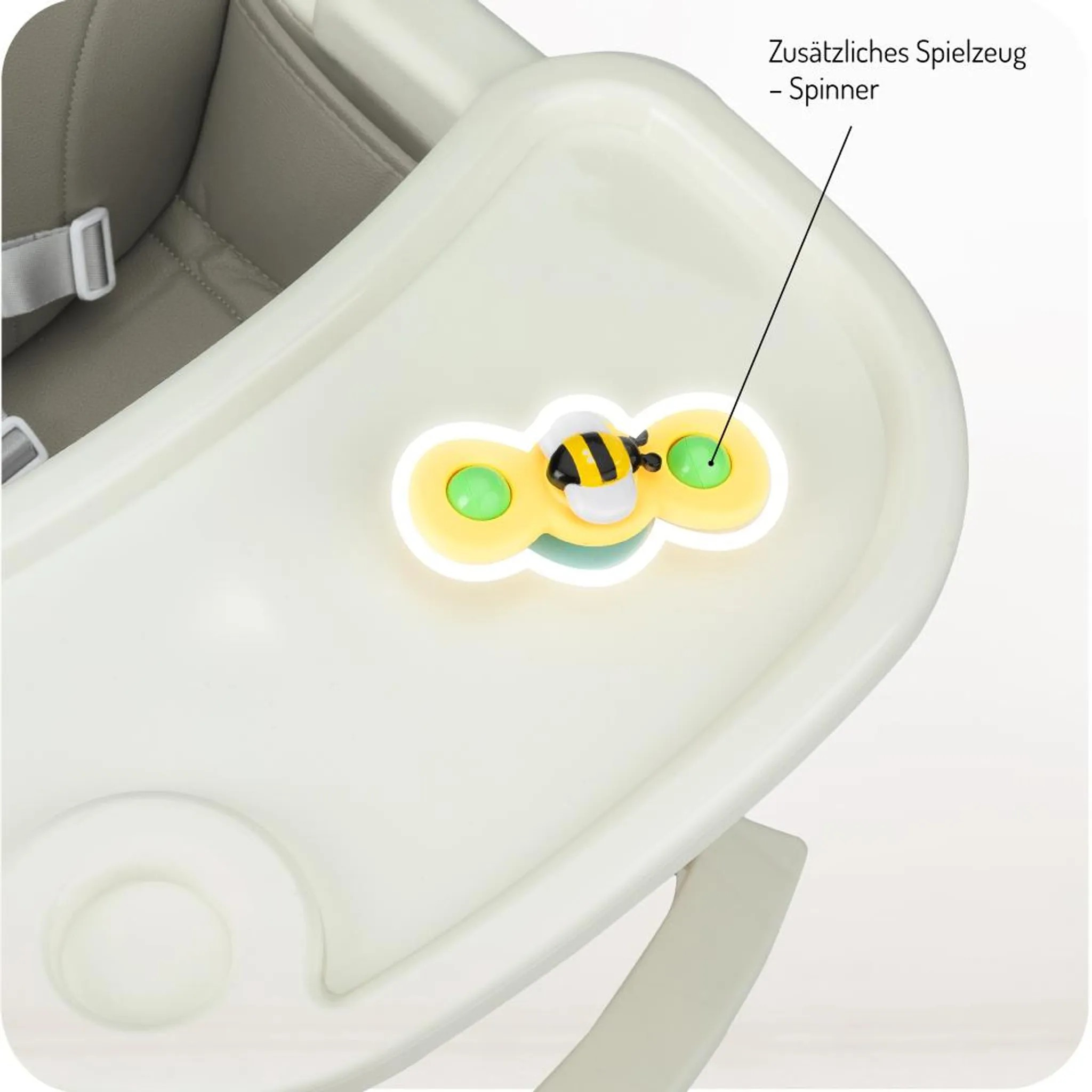 Ein gelber Spinner mit Bienenmotiv auf einem weißen Hochstuhl.