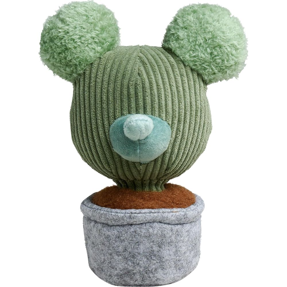 Un jouet cactus en peluche verte avec des oreilles rondes et un nez bleu dans un pot gris.