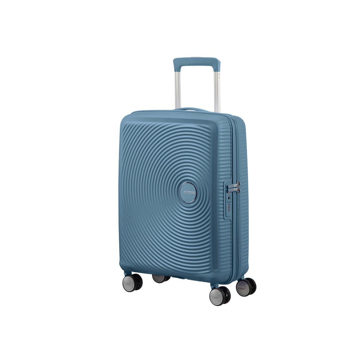 Ein blauer Koffer mit Rollen und ausziehbarem Griff.