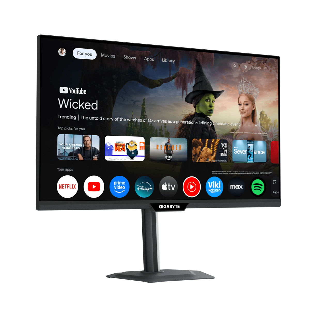 Een GIGABYTE monitor toont een Google TV-interface met films en apps zoals Netflix en YouTube.