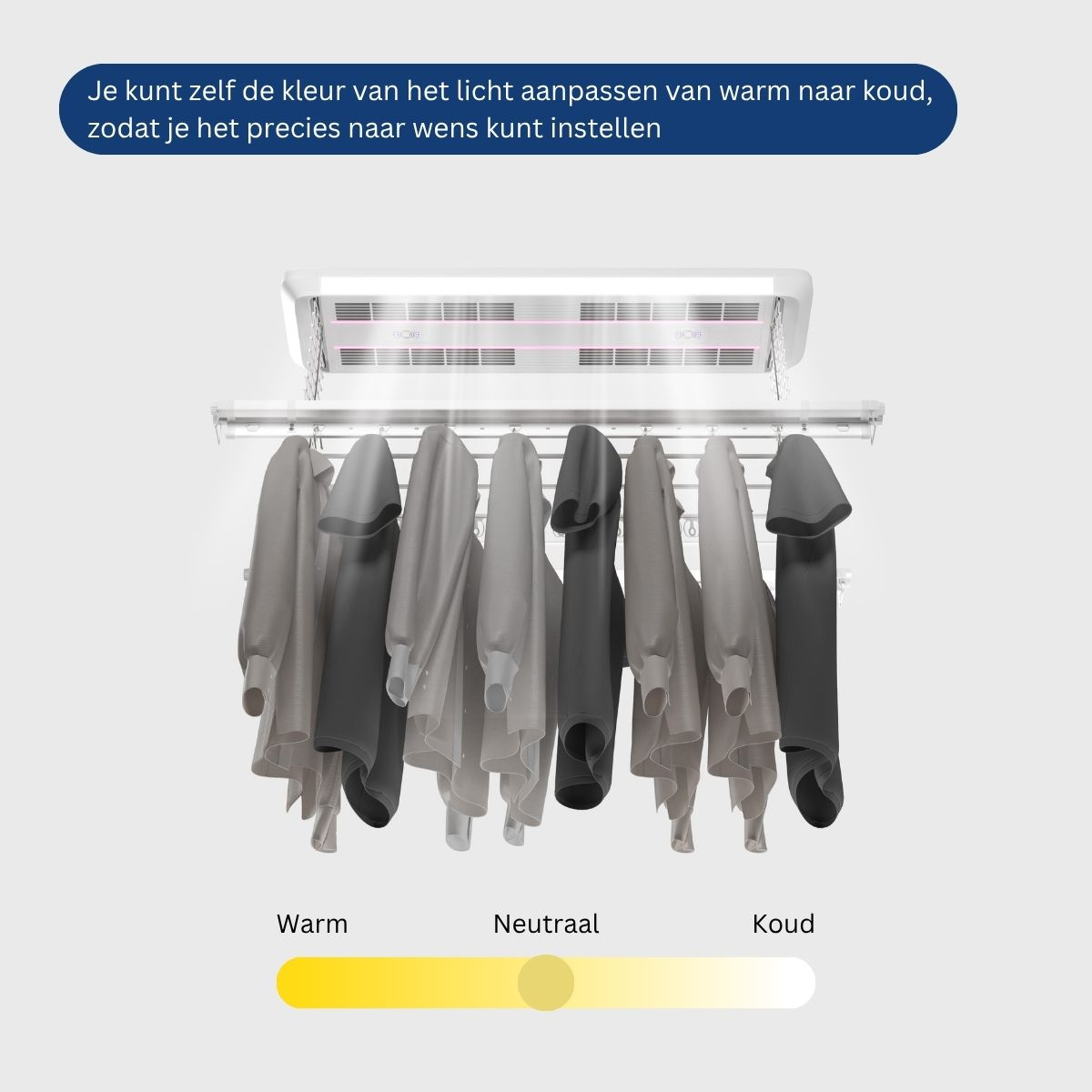 Un étendoir à linge avec des vêtements pend sous un appareil émettant de la lumière.