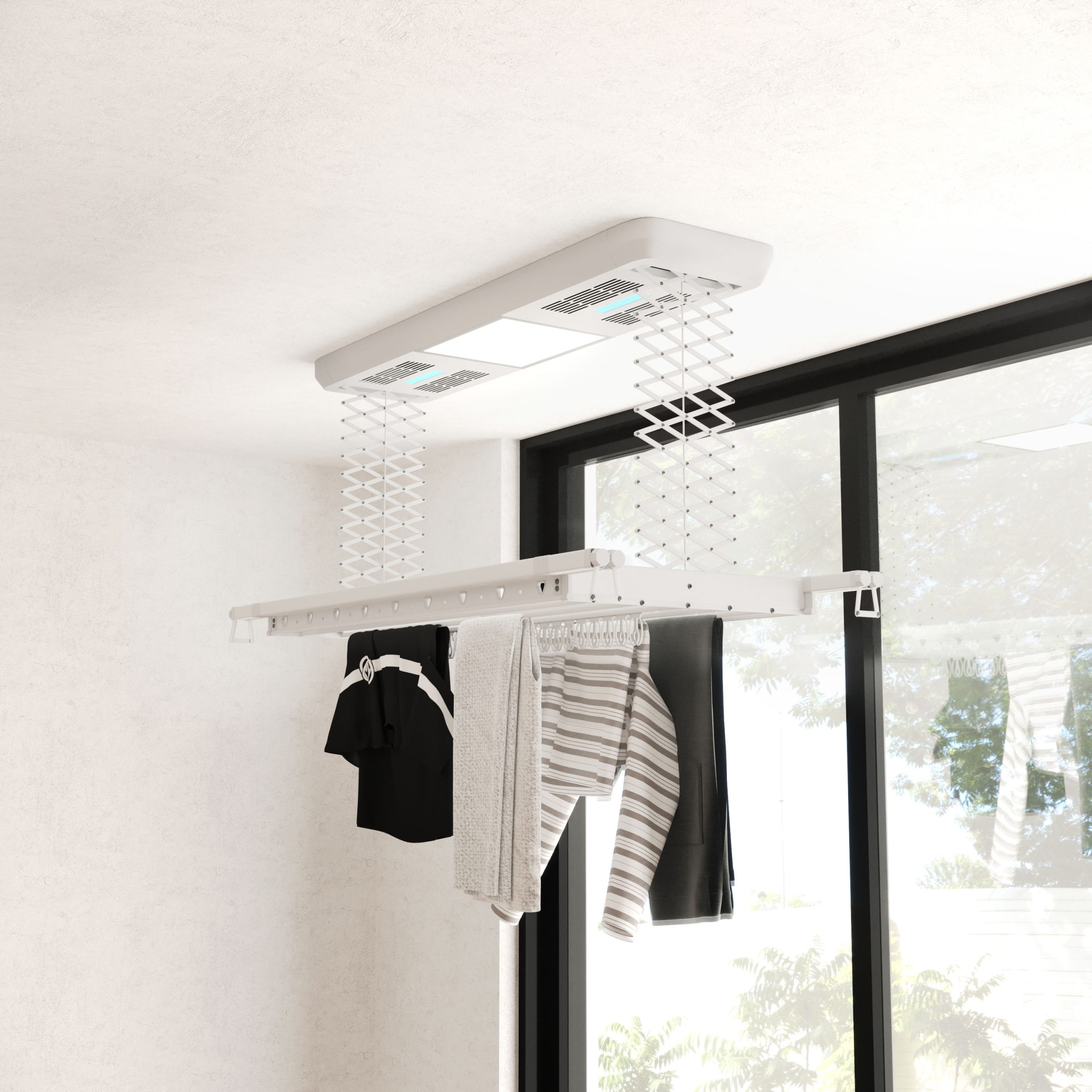 Un sèche-linge blanc suspendu au plafond avec du linge.