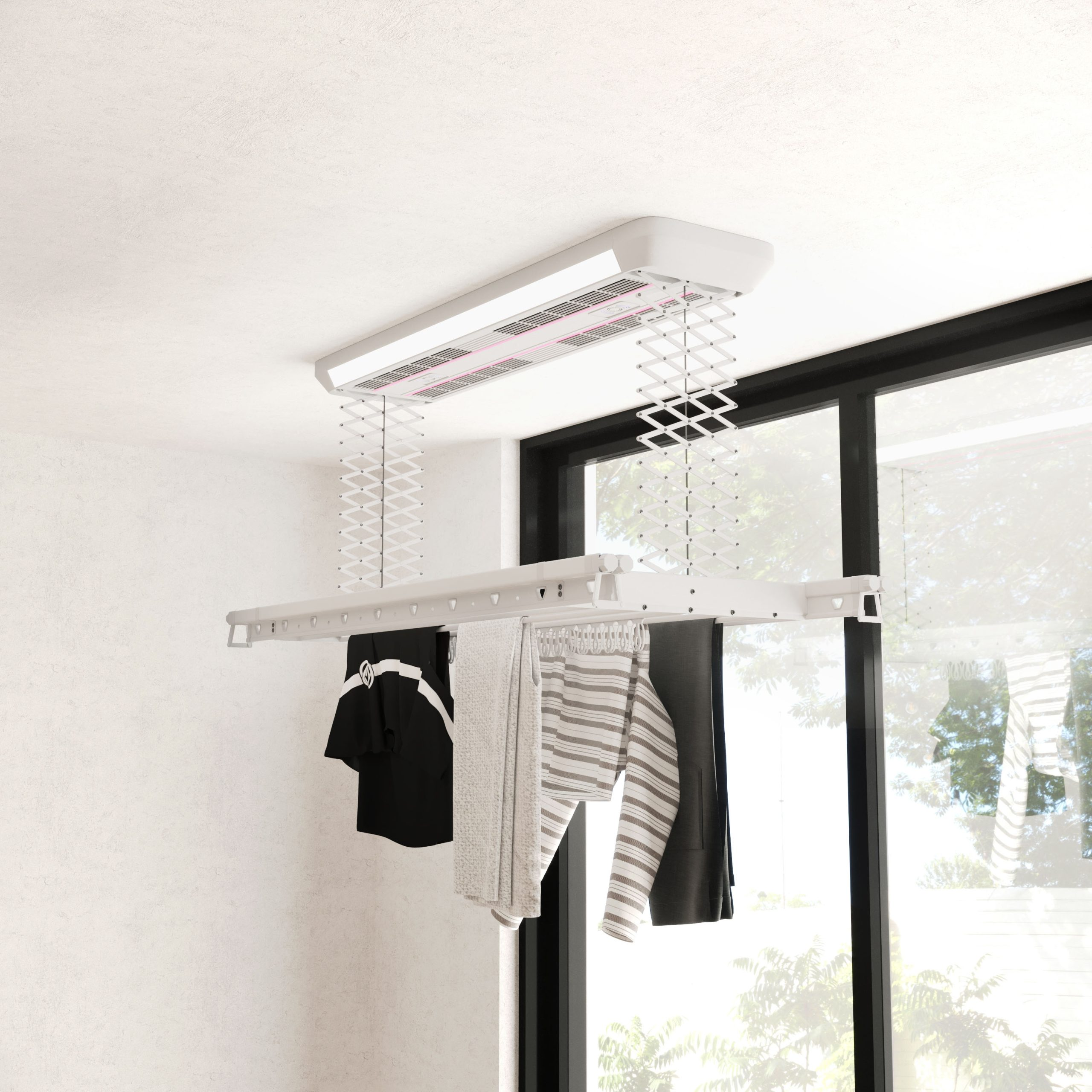 Un sèche-linge blanc suspendu au plafond avec du linge à l'intérieur.