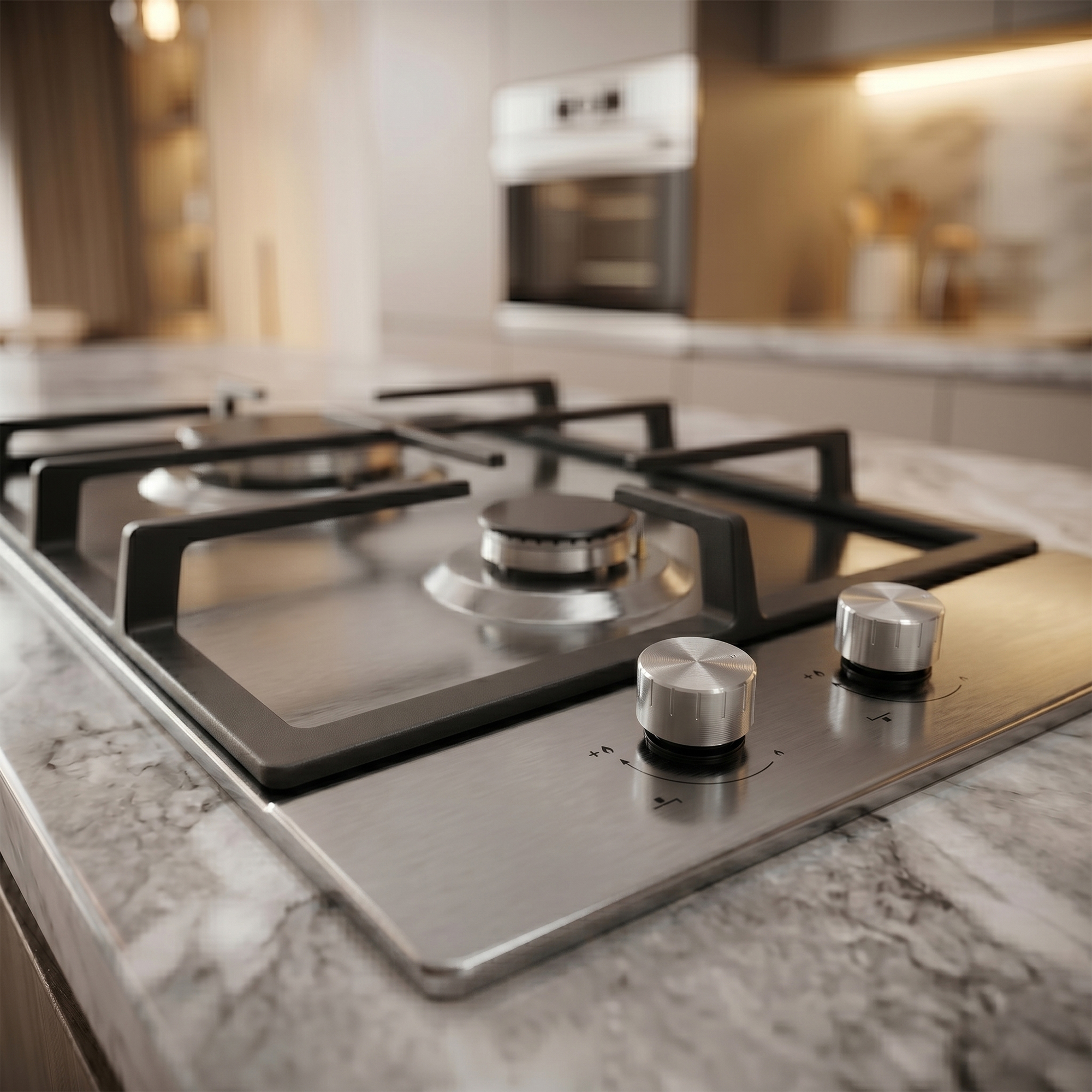 A modern stainless steel gas stovetop on a marble countertop.