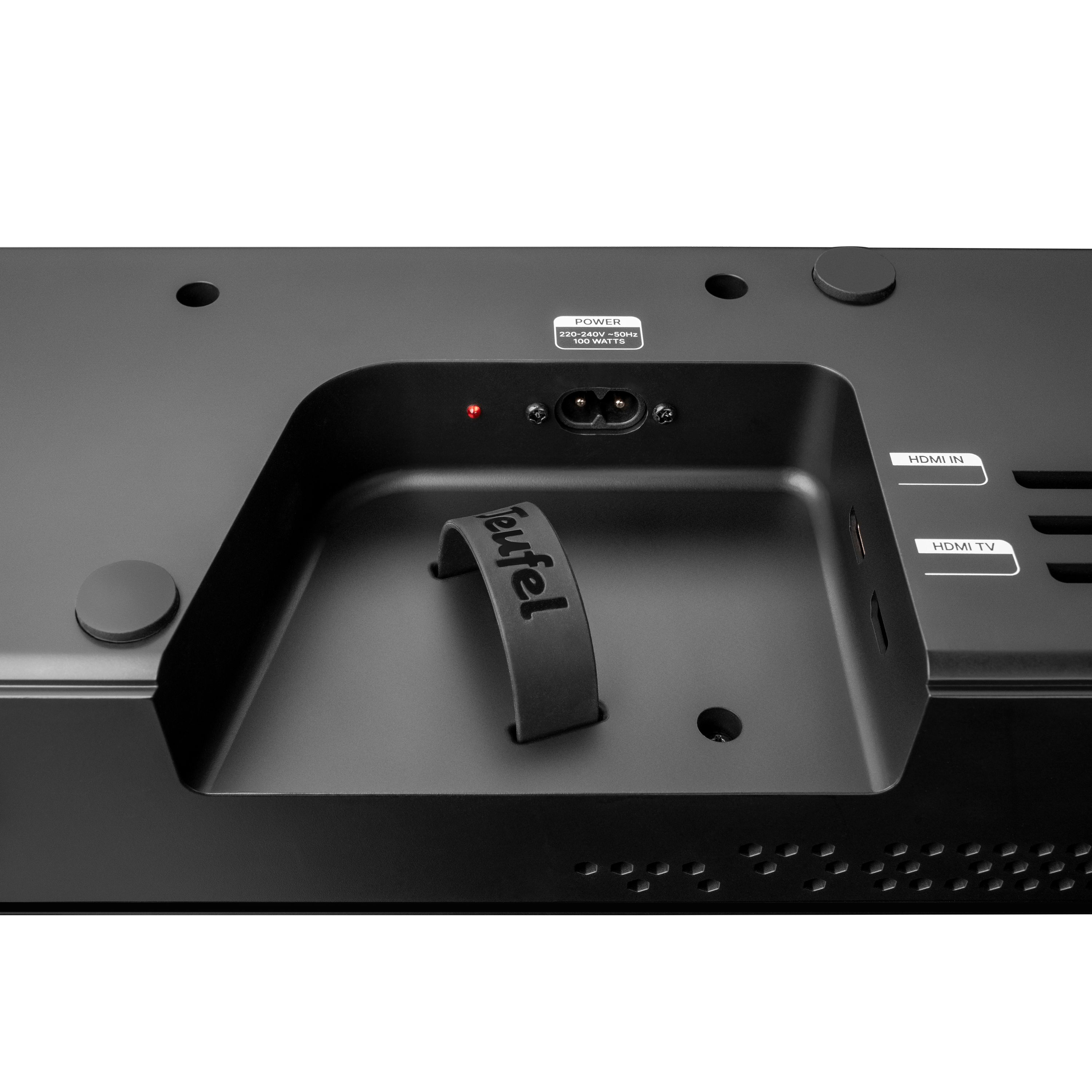 Rückseite eines schwarzen Lautsprechers mit Anschlüssen: Strom, HDMI IN, HDMI TV.