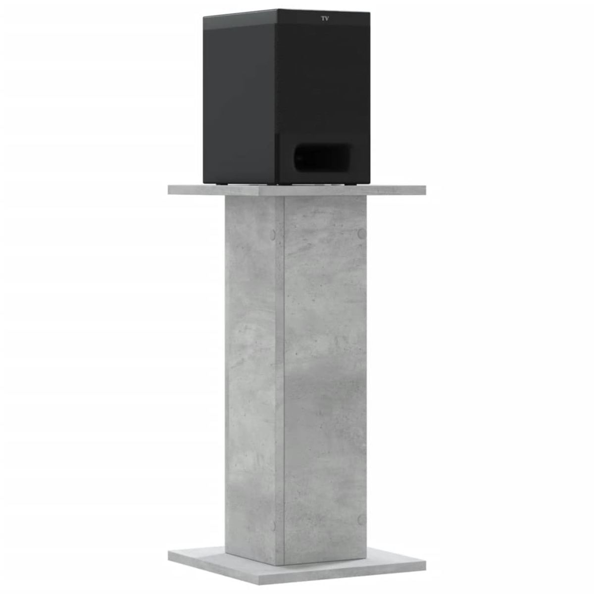 Ein schwarzer Subwoofer steht auf einem grauen Betonpodest.