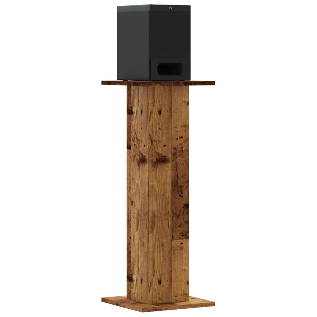 Schwarzer Subwoofer auf einem Holzsockel mit rustikaler Oberfläche.
