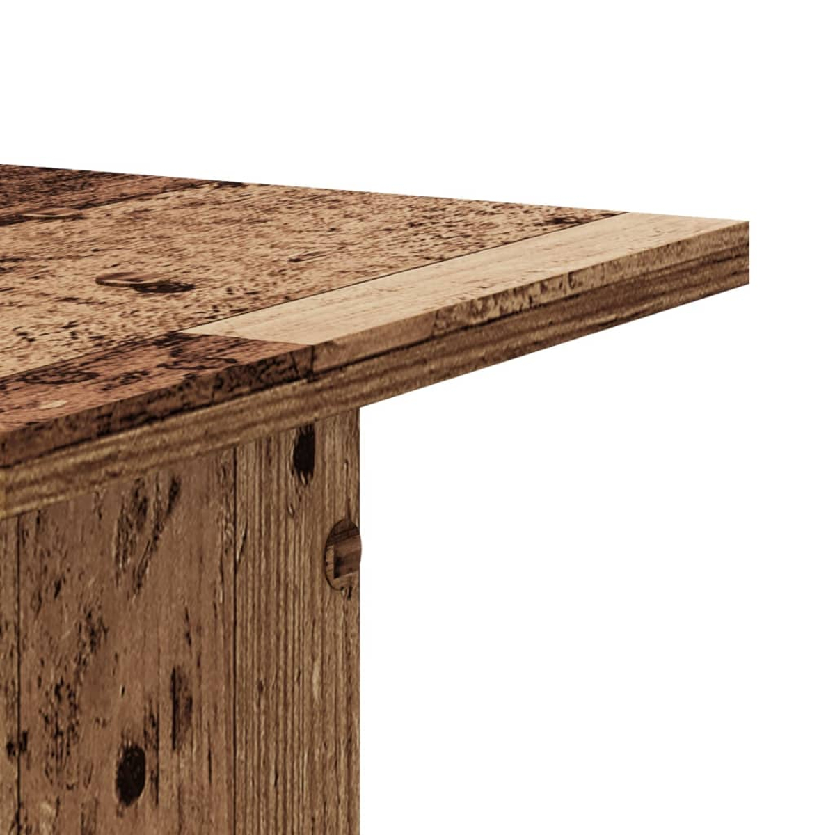 Detailaufnahme einer Holztischkante mit sichtbarer Maserung und Nägeln.