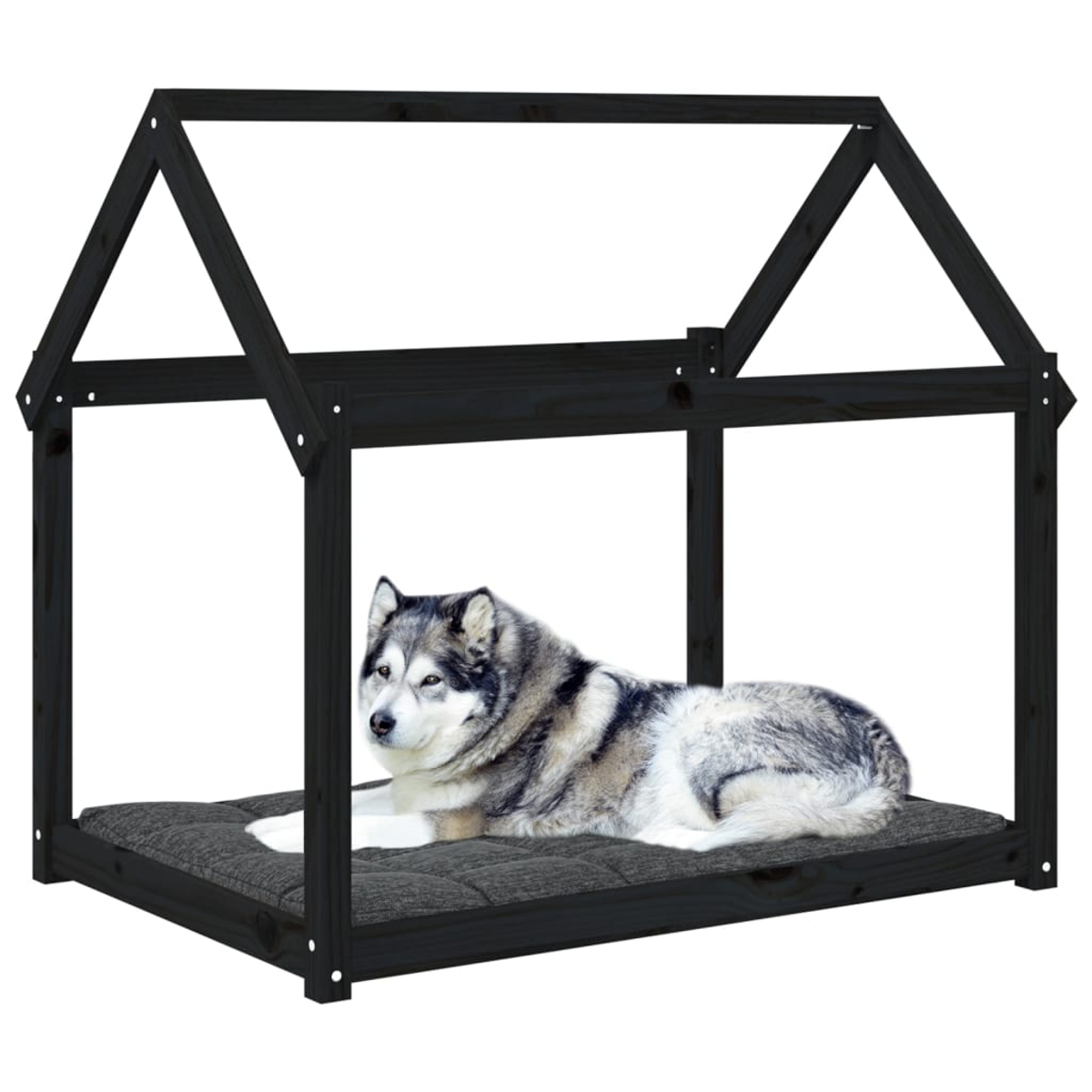 Ein Husky liegt auf einem Kissen in einem schwarzen Hundebett im Hausstil.