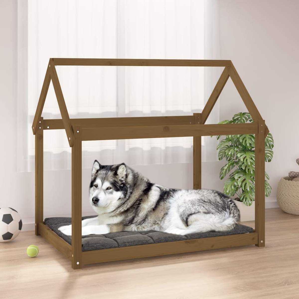 Ein Husky liegt auf einem Kissen in einem braunen Hundebett im Hausdesign.