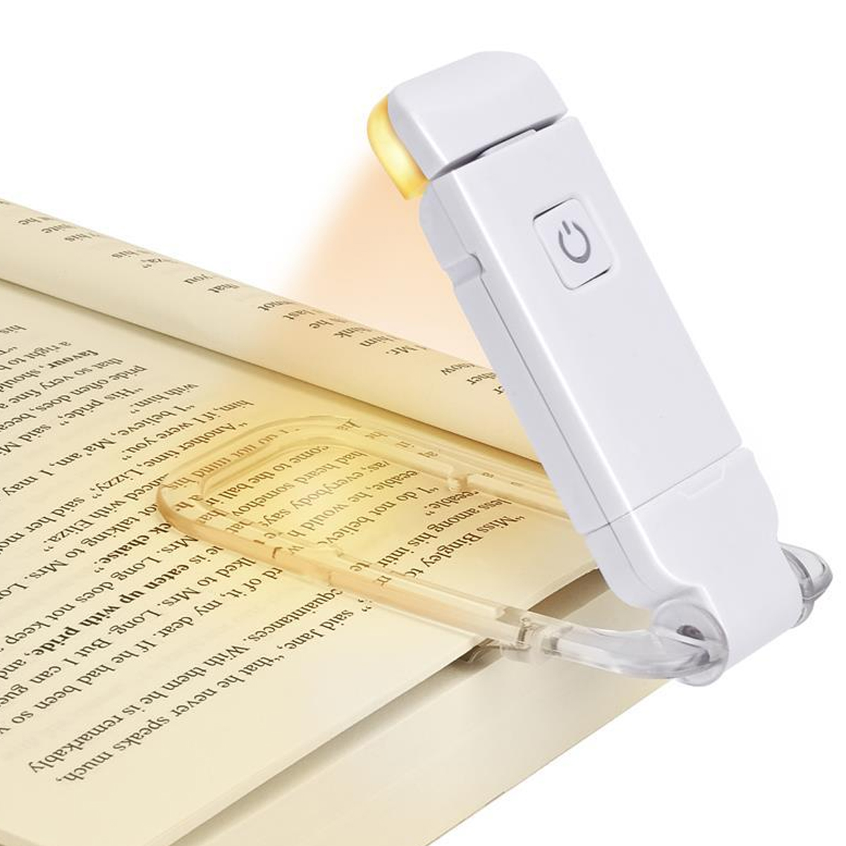 Ein weißes Buchlicht leuchtet auf einem aufgeschlagenen Buch.
