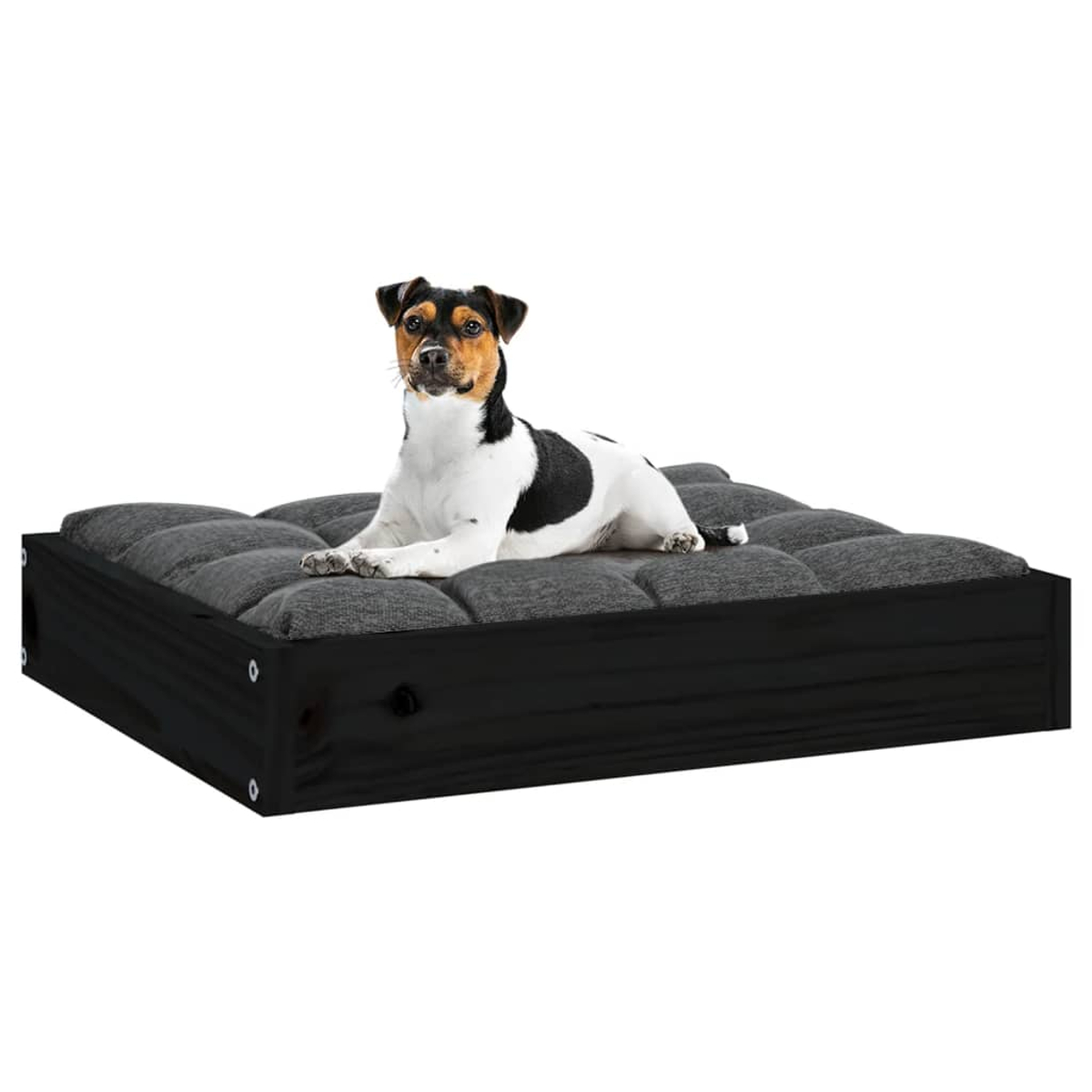 Ein Hund liegt auf einem gepolsterten Hundebett mit schwarzem Holzrahmen.