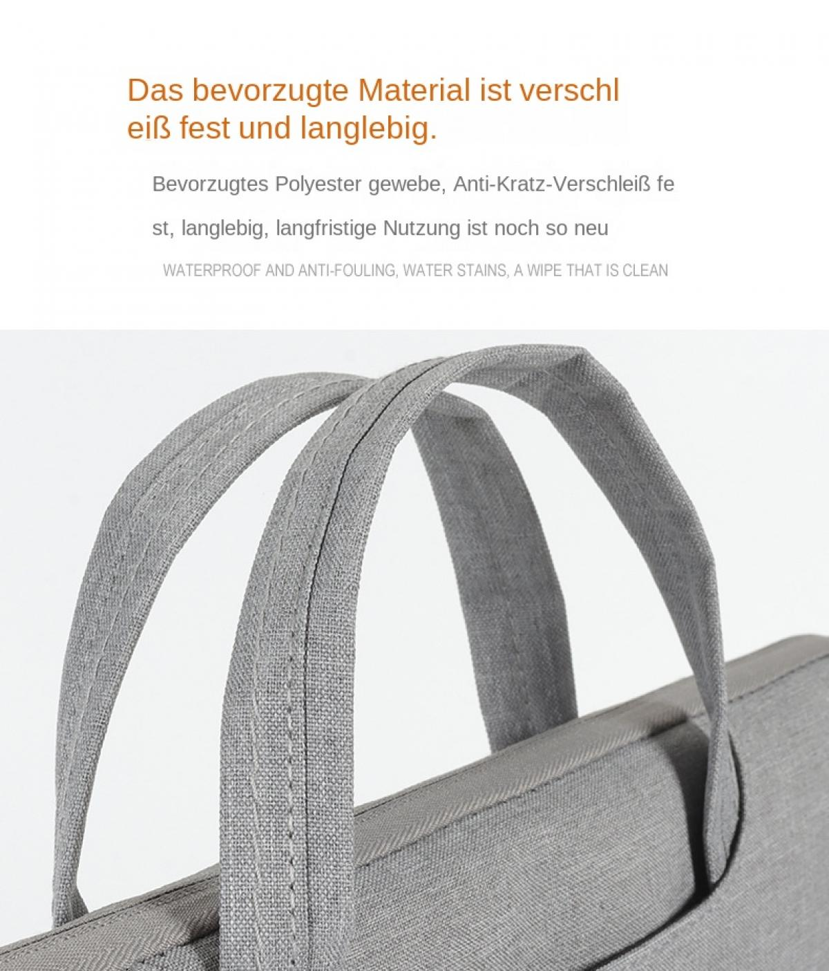 Graue Stofftasche mit Nähten und Henkeln. Material texturiert.