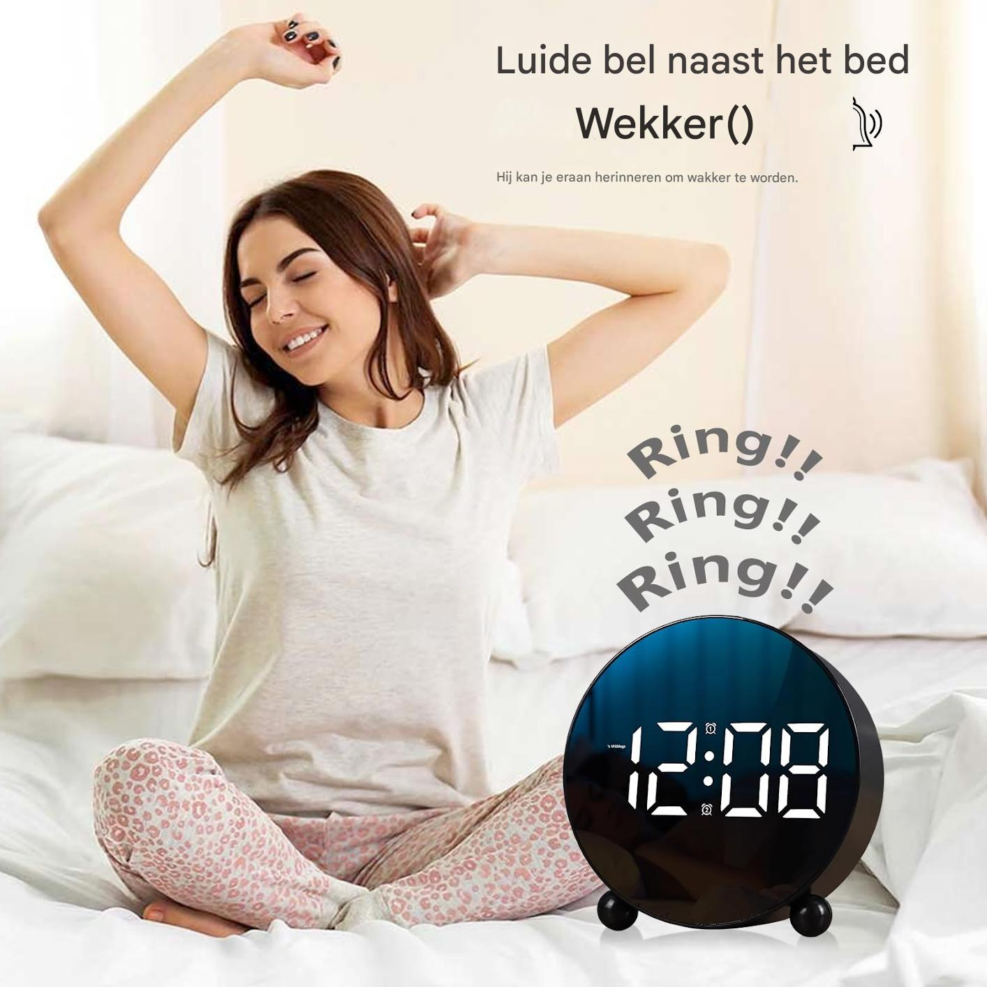 Eine Frau streckt sich im Bett, ein Wecker zeigt 12:08 an. Klingelgeräusche sind zu hören.