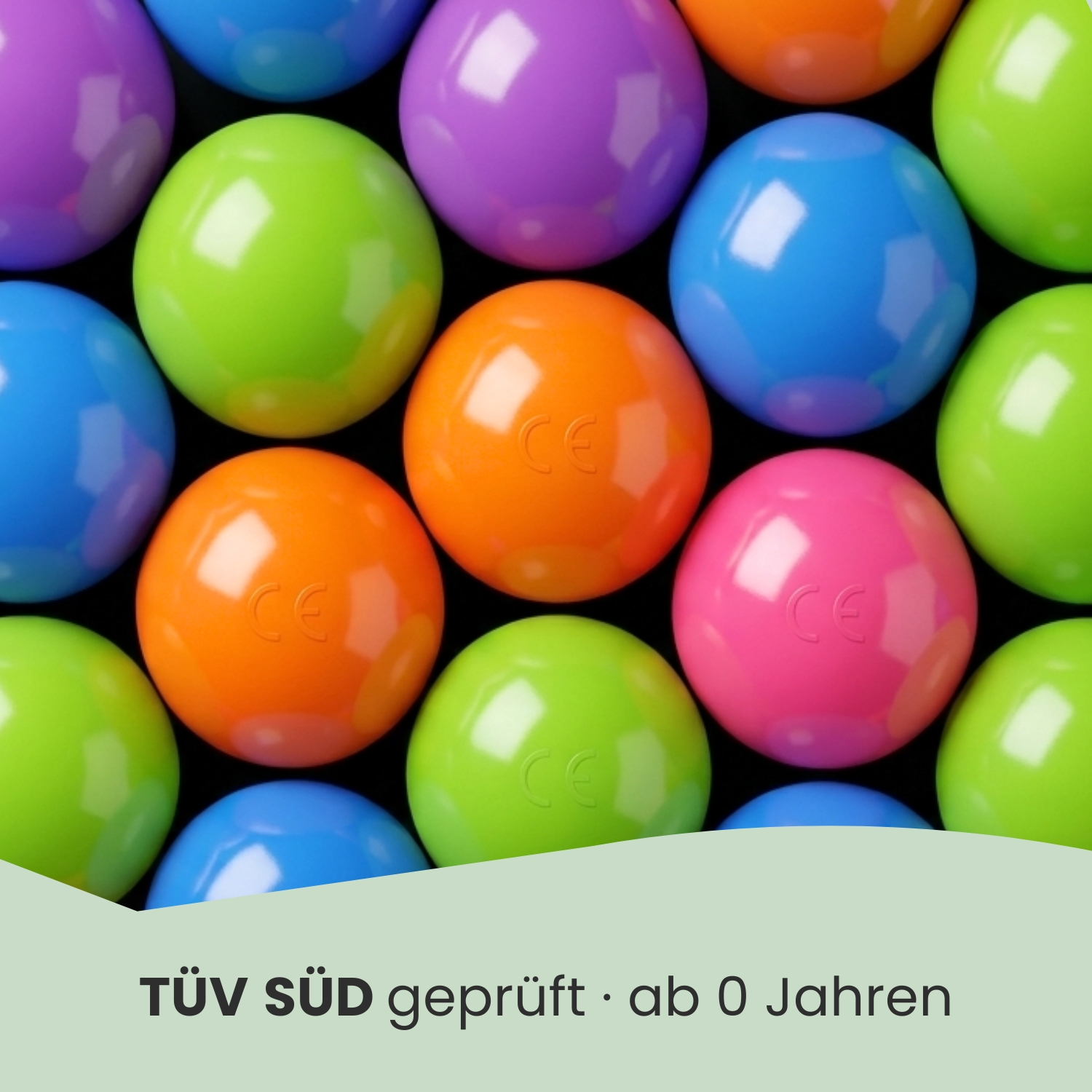 Bunte Kugeln in Lila, Grün, Blau und Orange auf schwarzem Hintergrund.