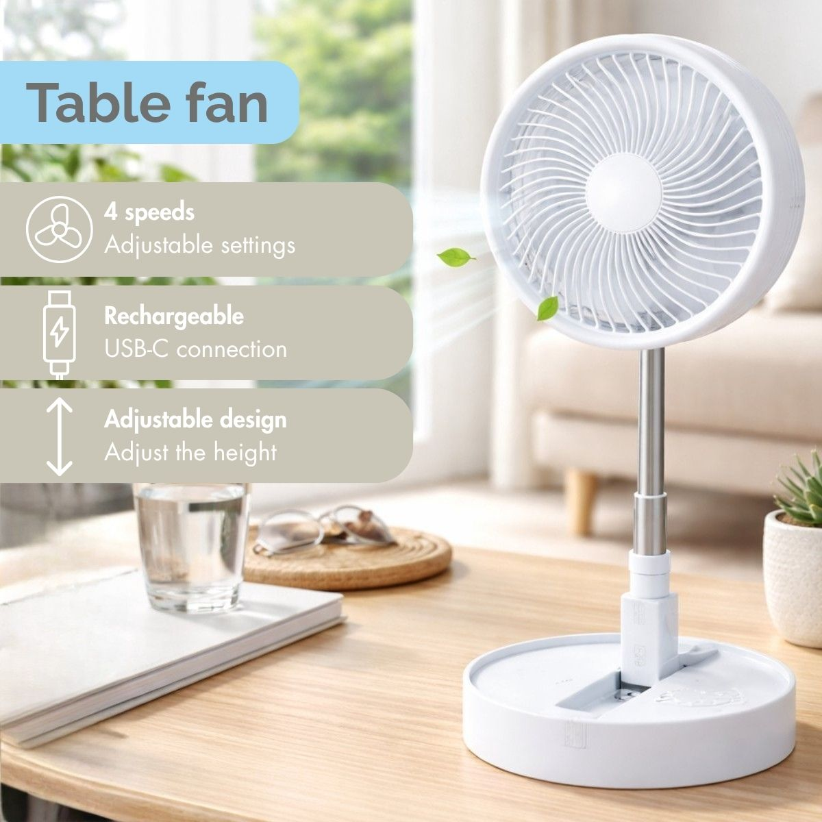 Un ventilateur de table blanc avec un support réglable sur une table en bois.