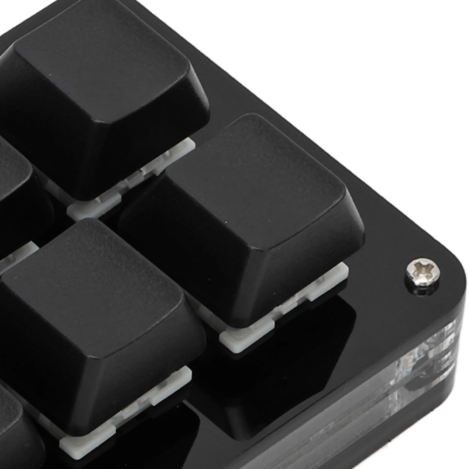 Nahaufnahme einer schwarzen mechanischen Tastatur mit sichtbaren Schaltern und einem klaren Acrylgehäuse.